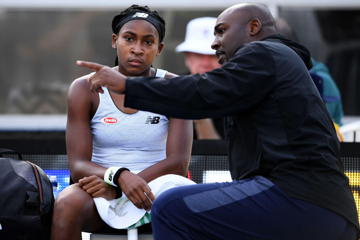Coco Gauff (L) is coached by her father, Corey Gauff, in 2020.
