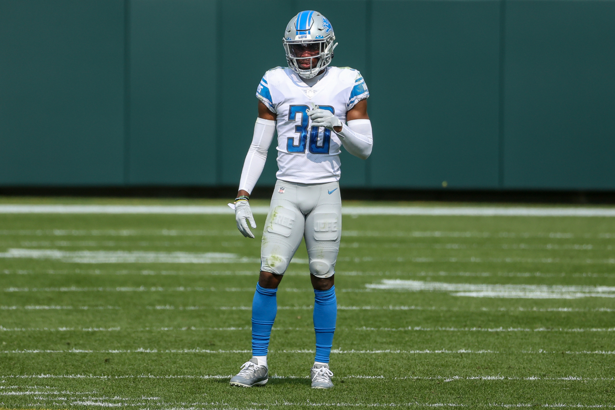 Jeff Okudah looks on before a play in a Lions game
