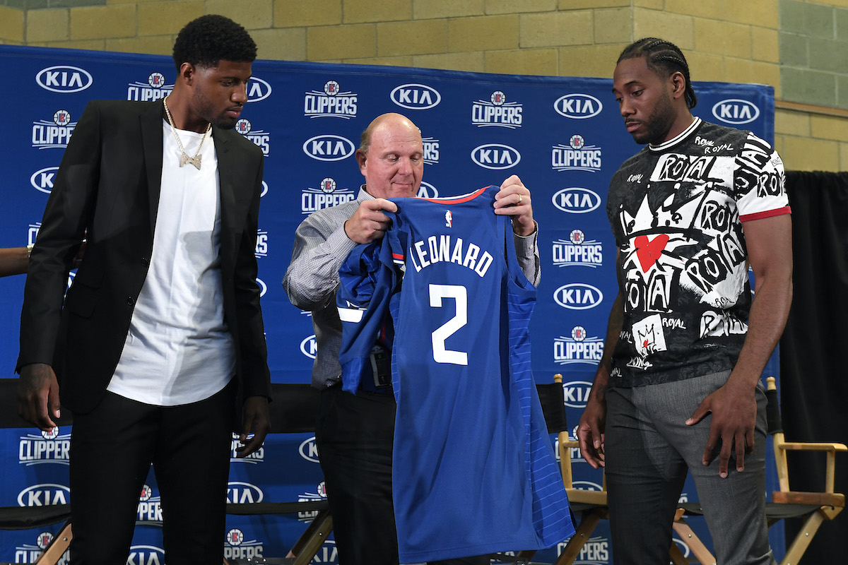 Clippers owner Steve Ballmer with Paul George and Kawhi Leonard
