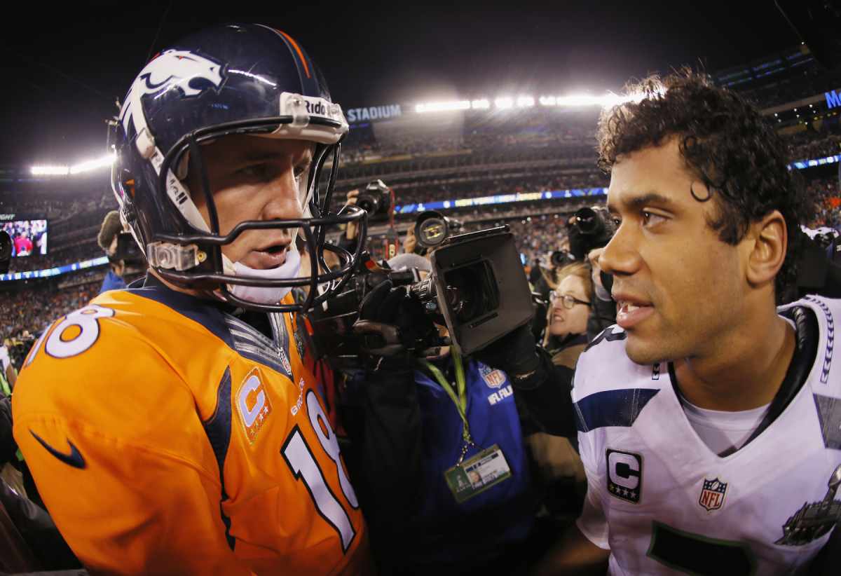 Peyton Manning and Russell Wilson shake hands after the Super Bowl