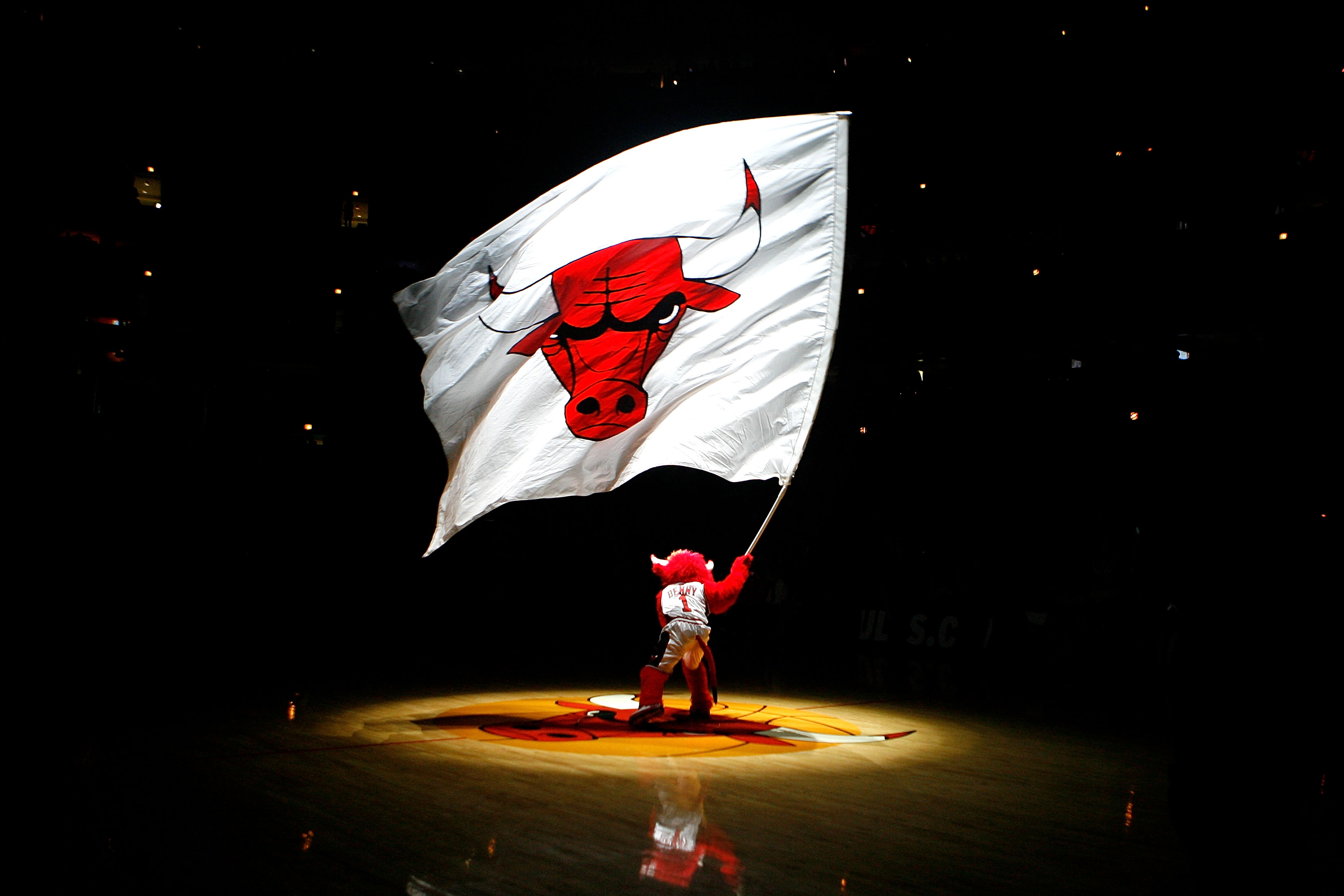 Benny the Bull, mascot for the Chicago Bulls, waves a giant flag with the Bulls' logo on it