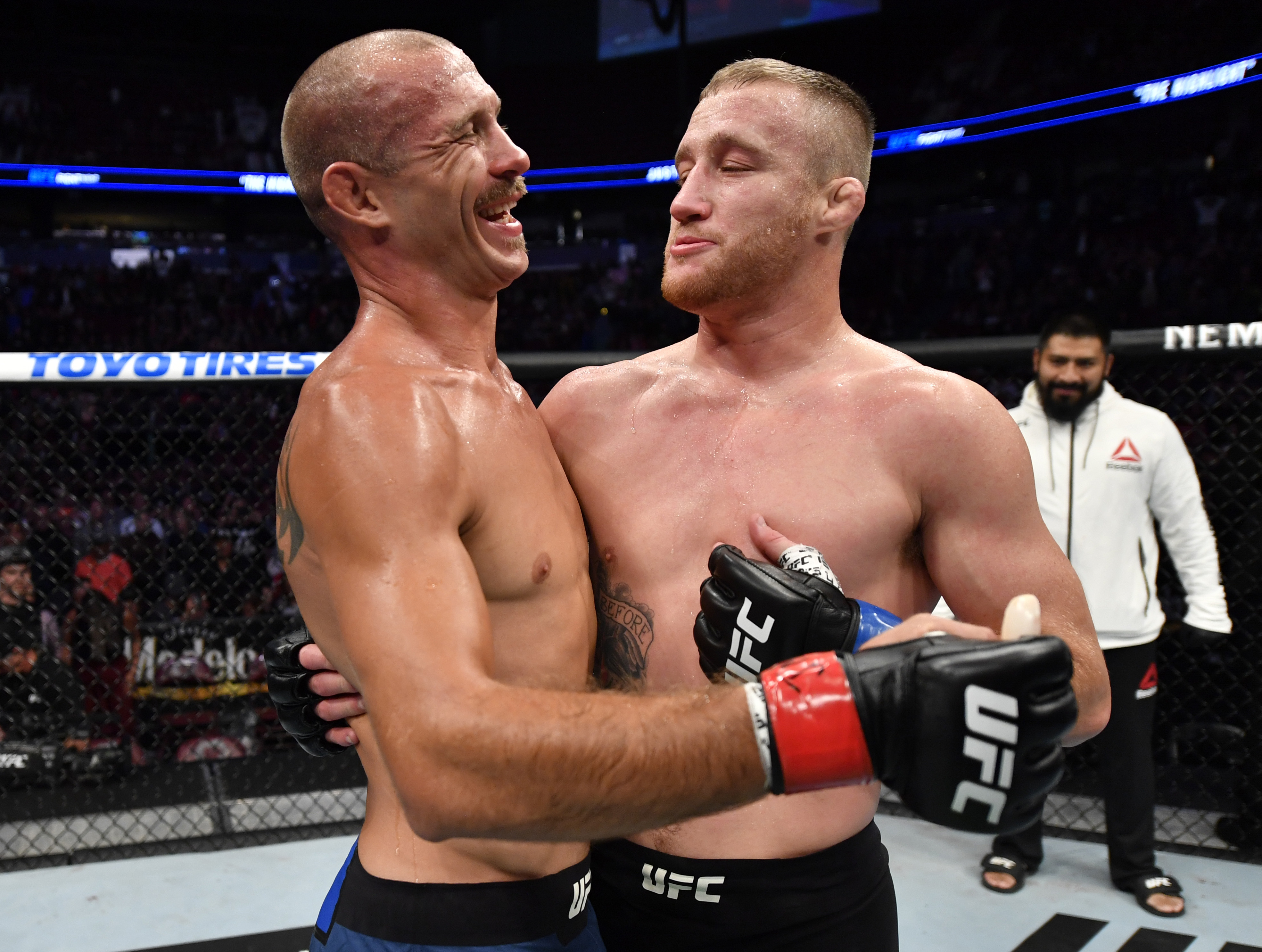 Justin Gaethje and Donald Cerrone hug after their lightweight bout