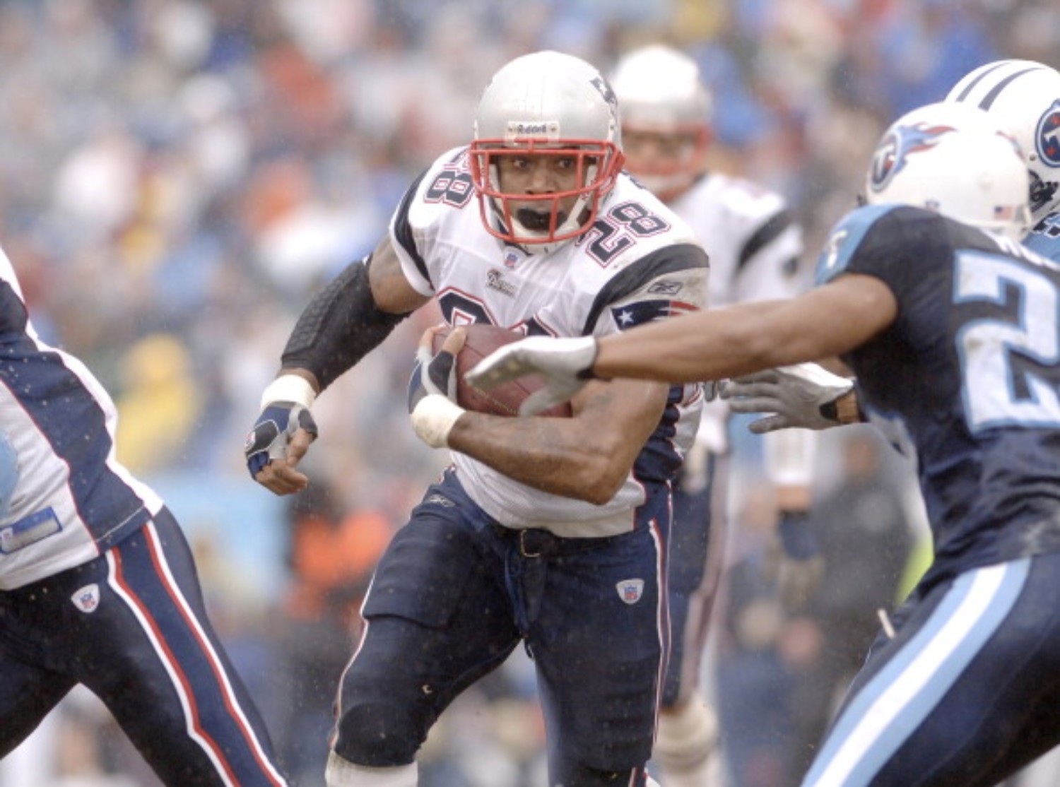 Corey Dillon carries the football for the New England Patriots