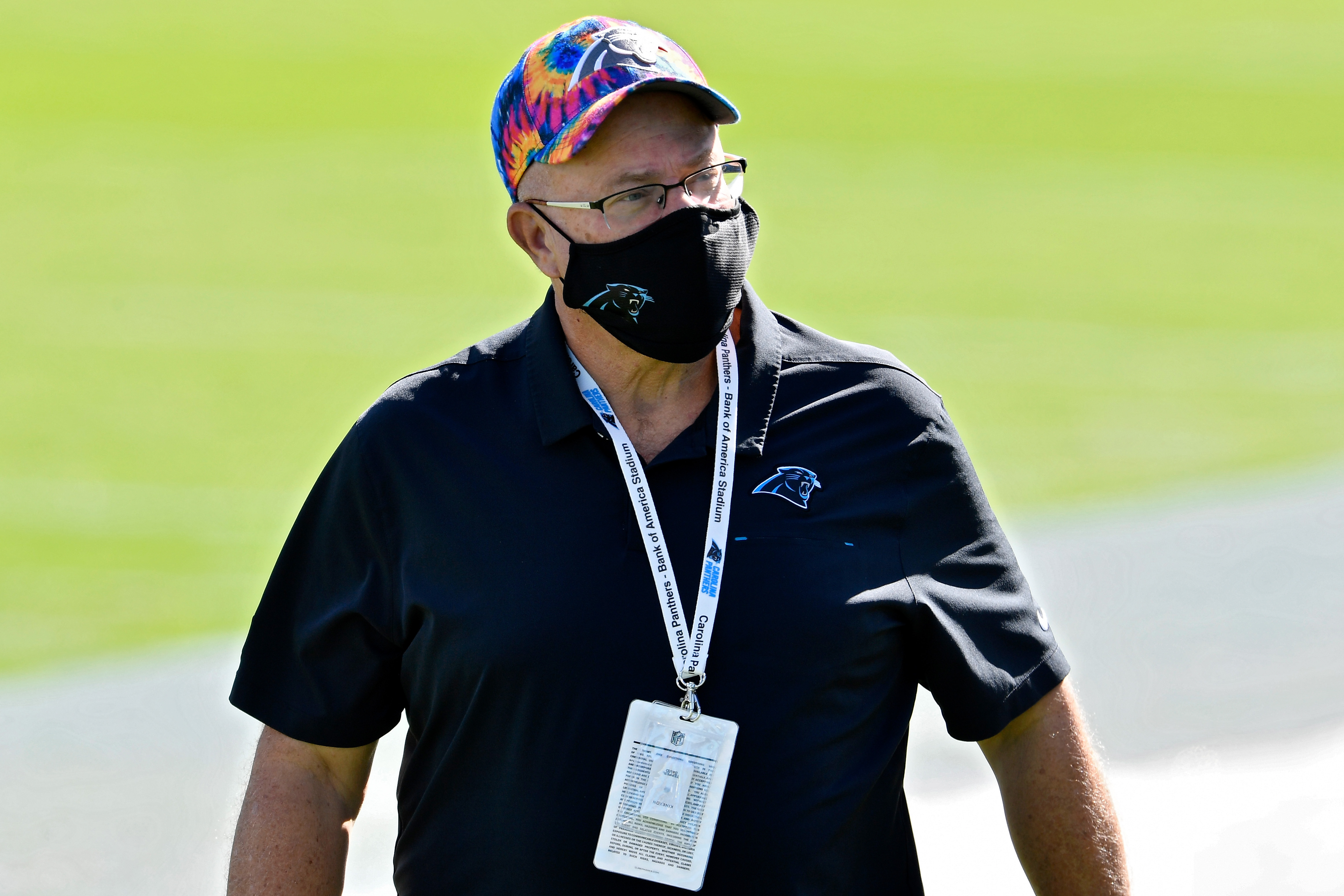 Carolina Panthers owner David Tepper walks across the field