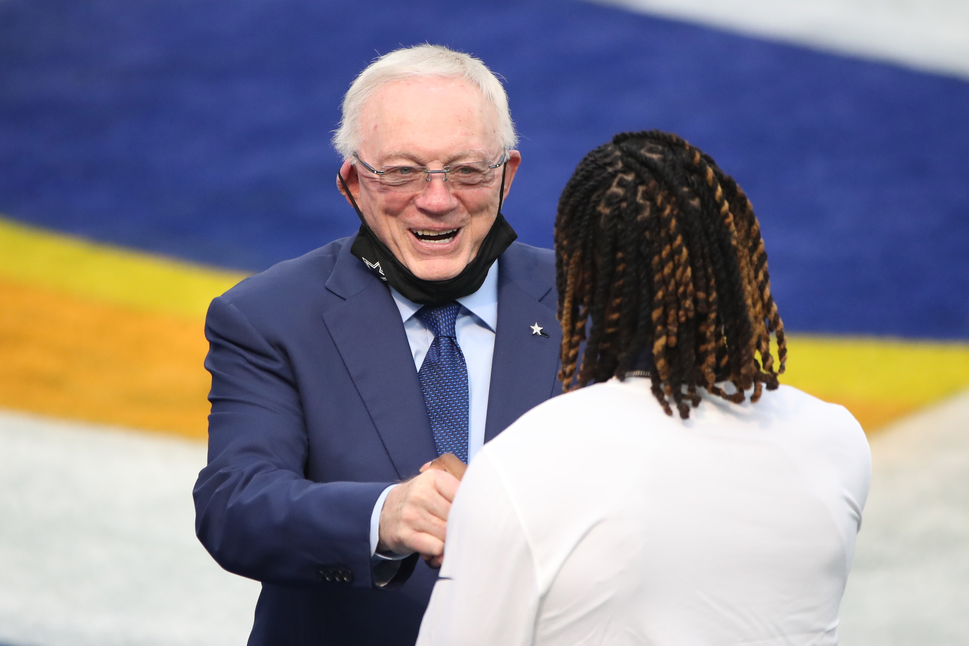 Dallas Cowboys owner Jerry Jones talks with CeeDee Lamb before a game