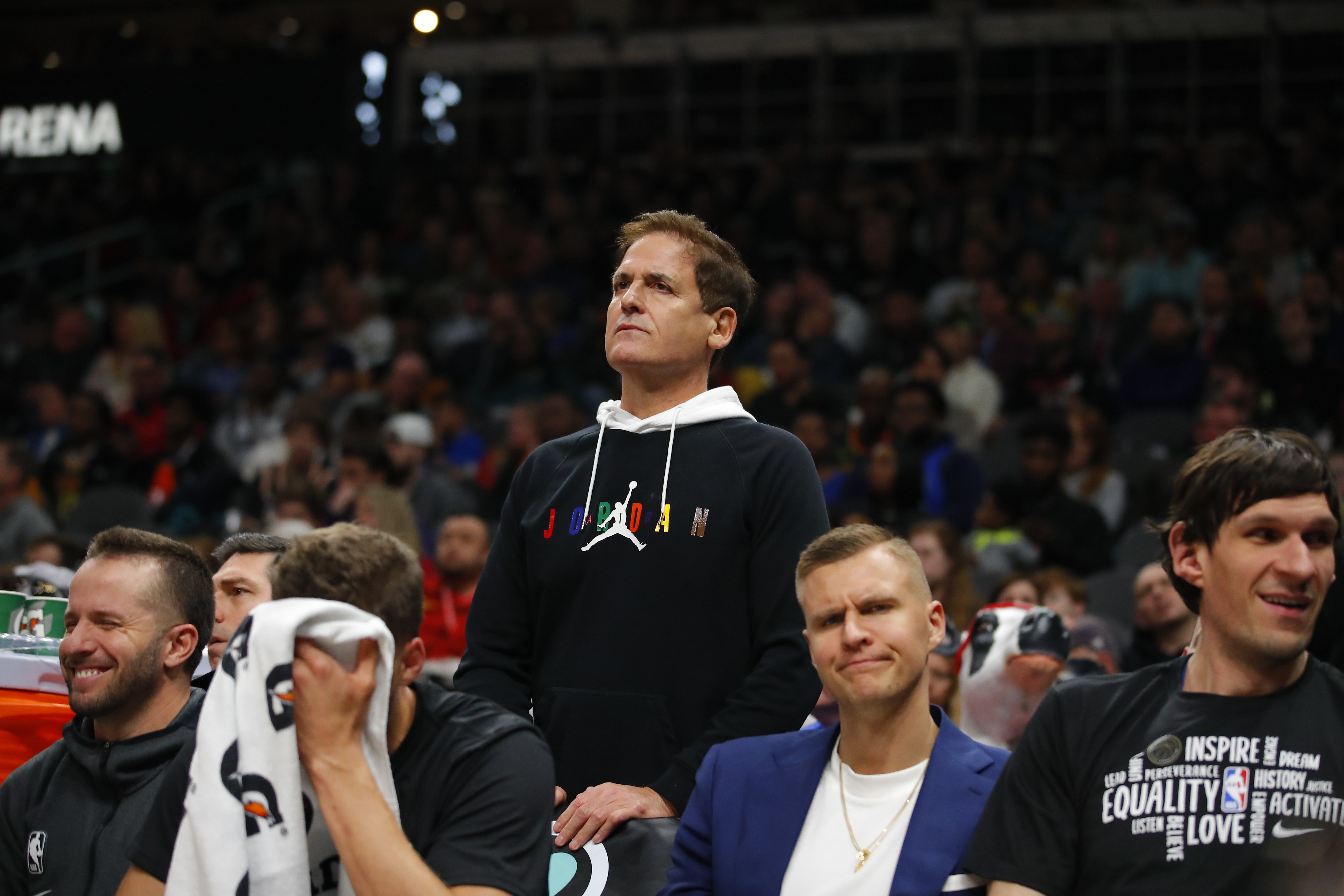 Dallas Mavericks owner Mark Cuban watches on from behind the bench