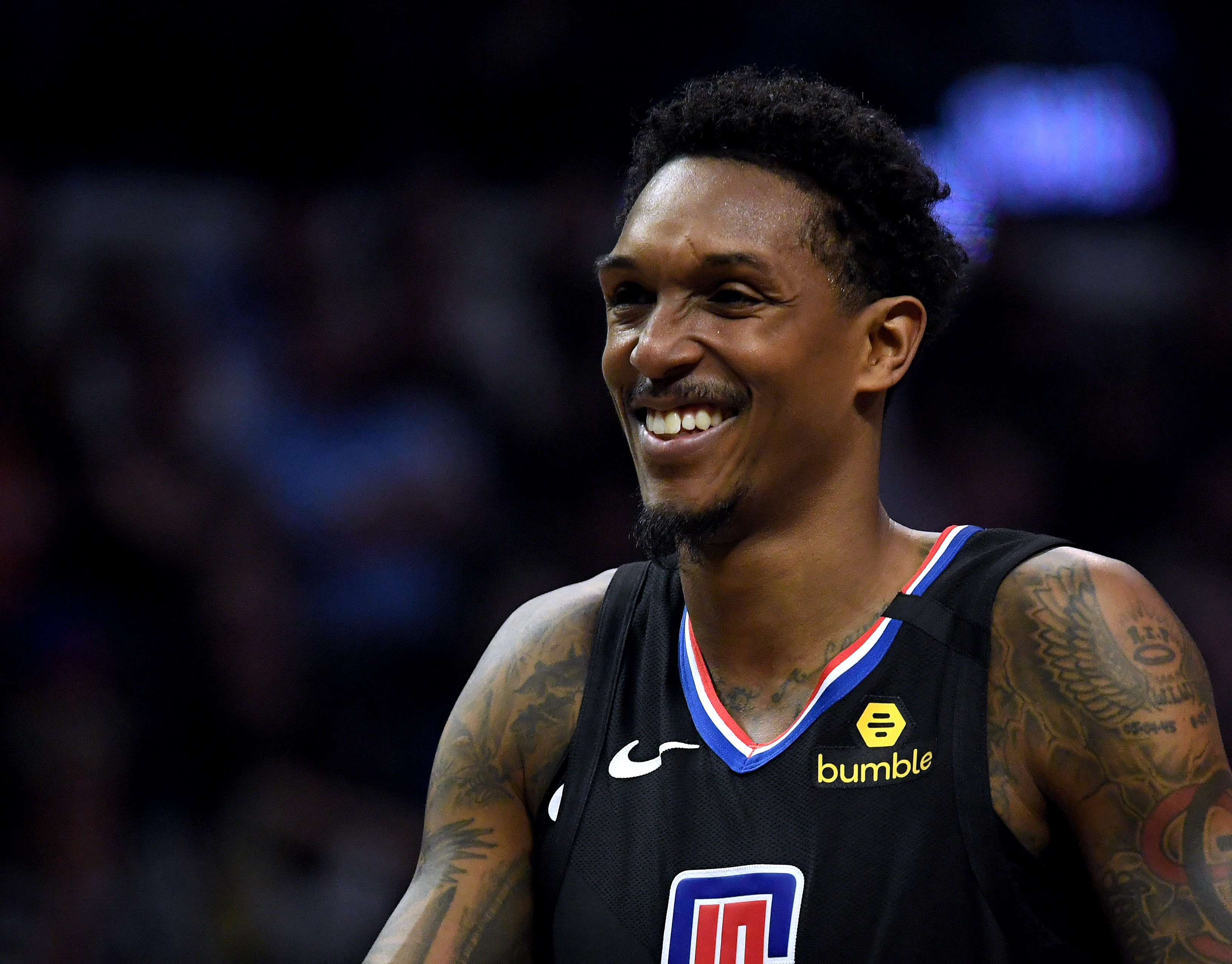 Lou Williams of the LA Clippers smiles during a timeout