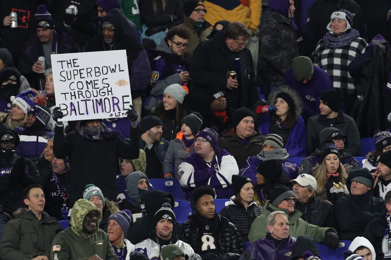 A Baltimore Ravens fan holds up Super Bowl sign.
