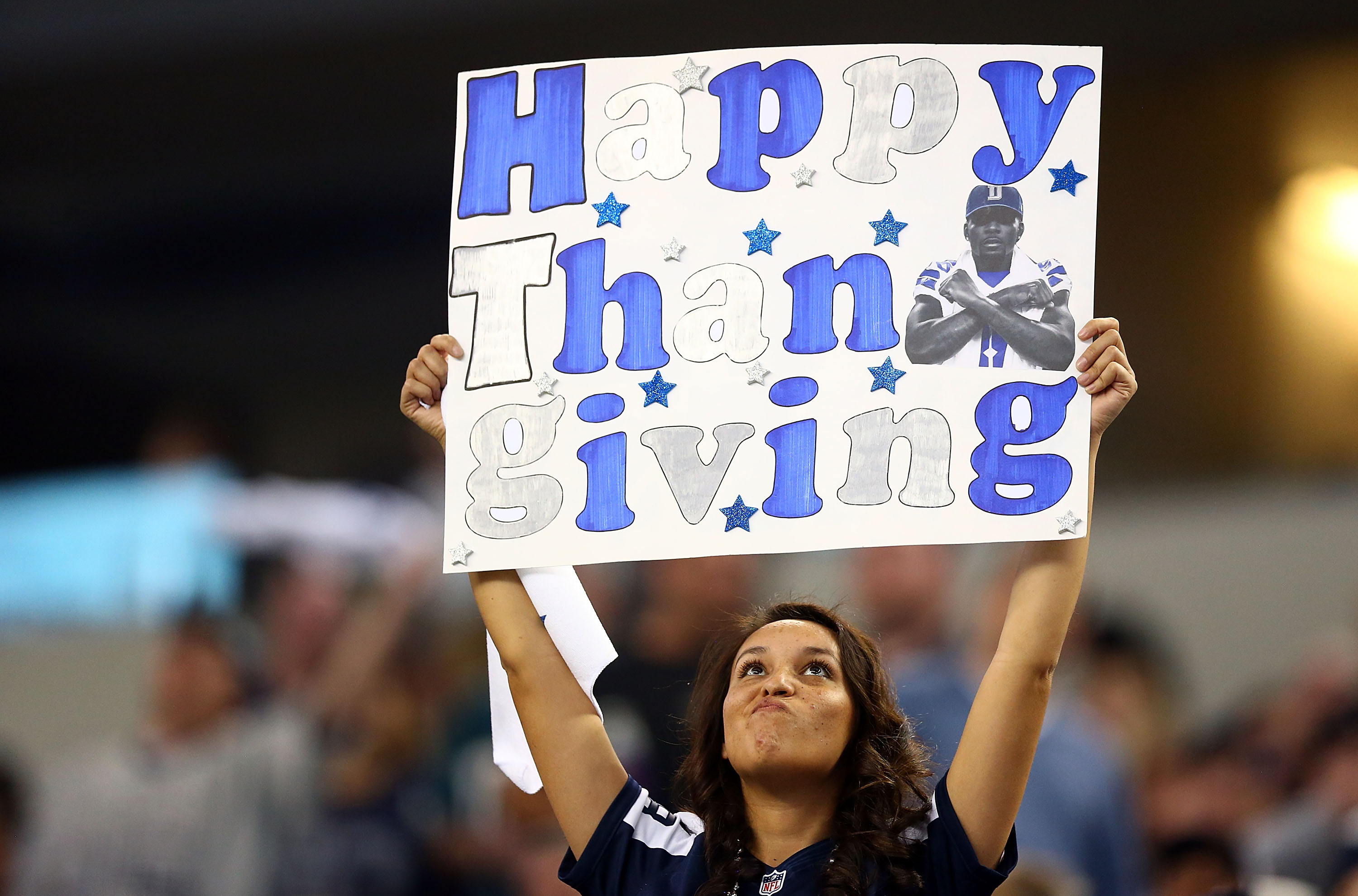 When did the NFL add a third team to the Thanksgiving Day menu?