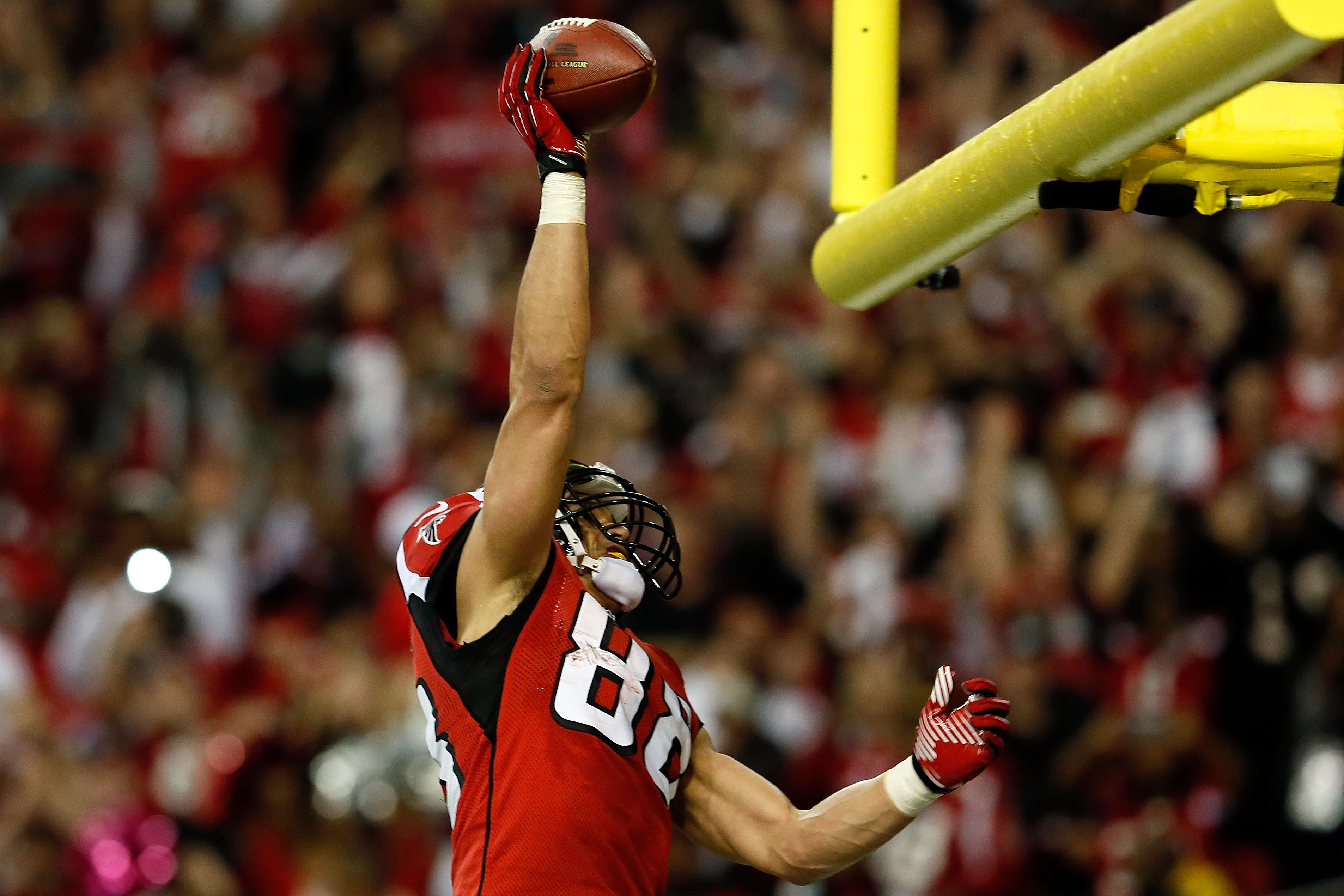 Tight end Tony Gonzalez of the Atlanta Falcons dunks the ball over the goal post
