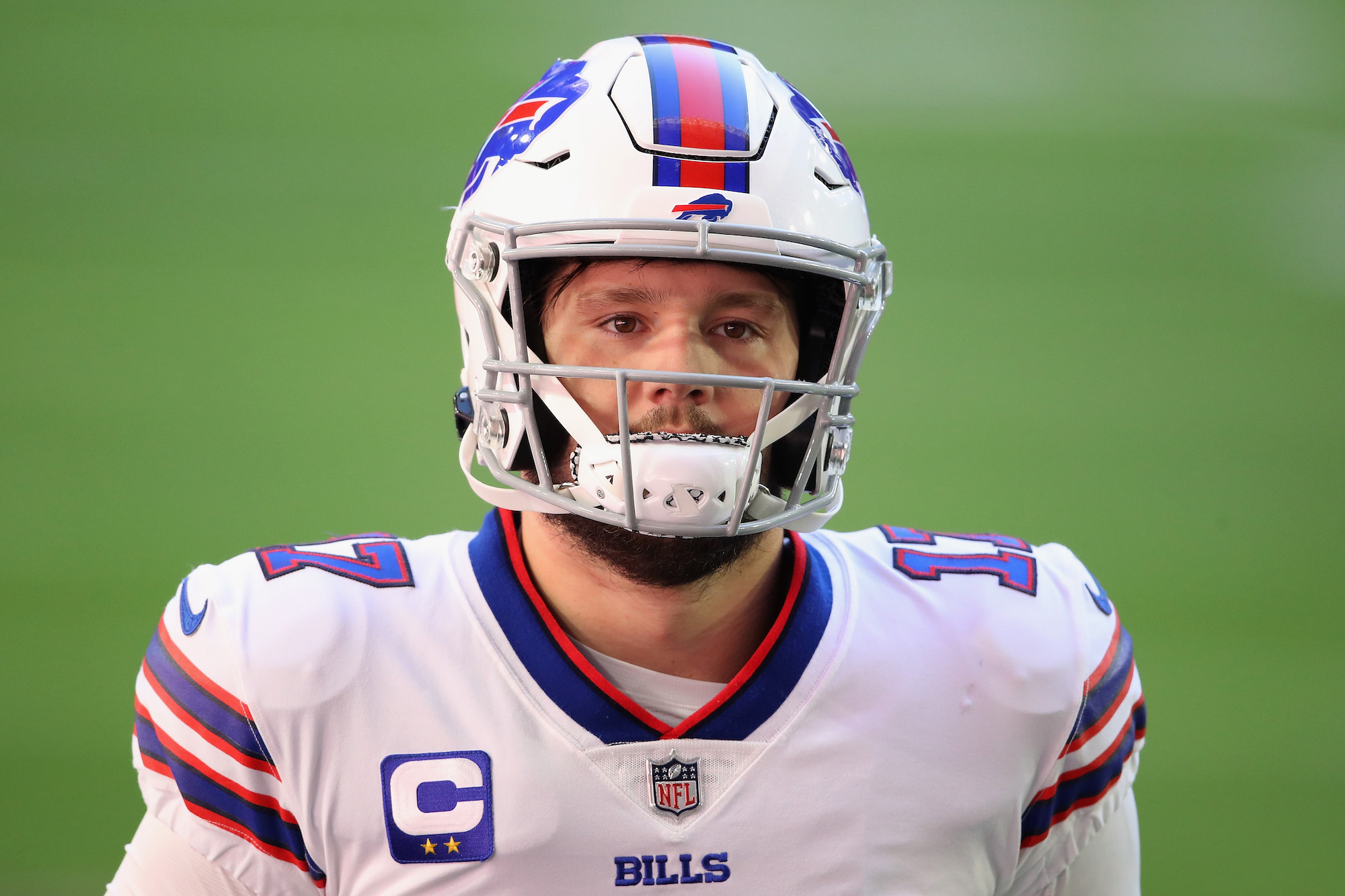 Quarterback Josh Allen #17 of the Buffalo Bills warms up before the NFL game against the Arizona Cardinals at State Farm Stadium on November 15, 2020 in Glendale, Arizona.