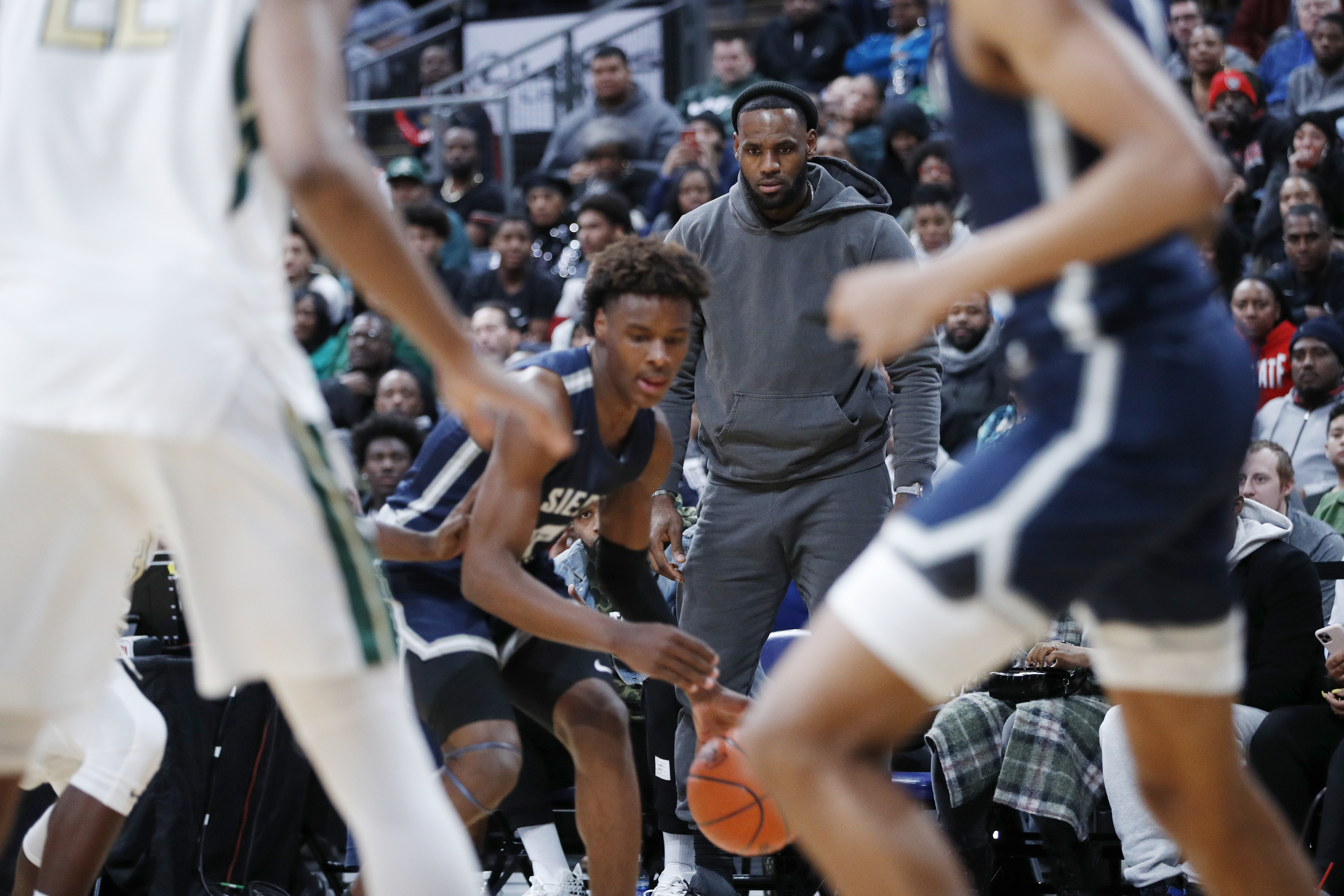 LeBron James watches his son, Bronny