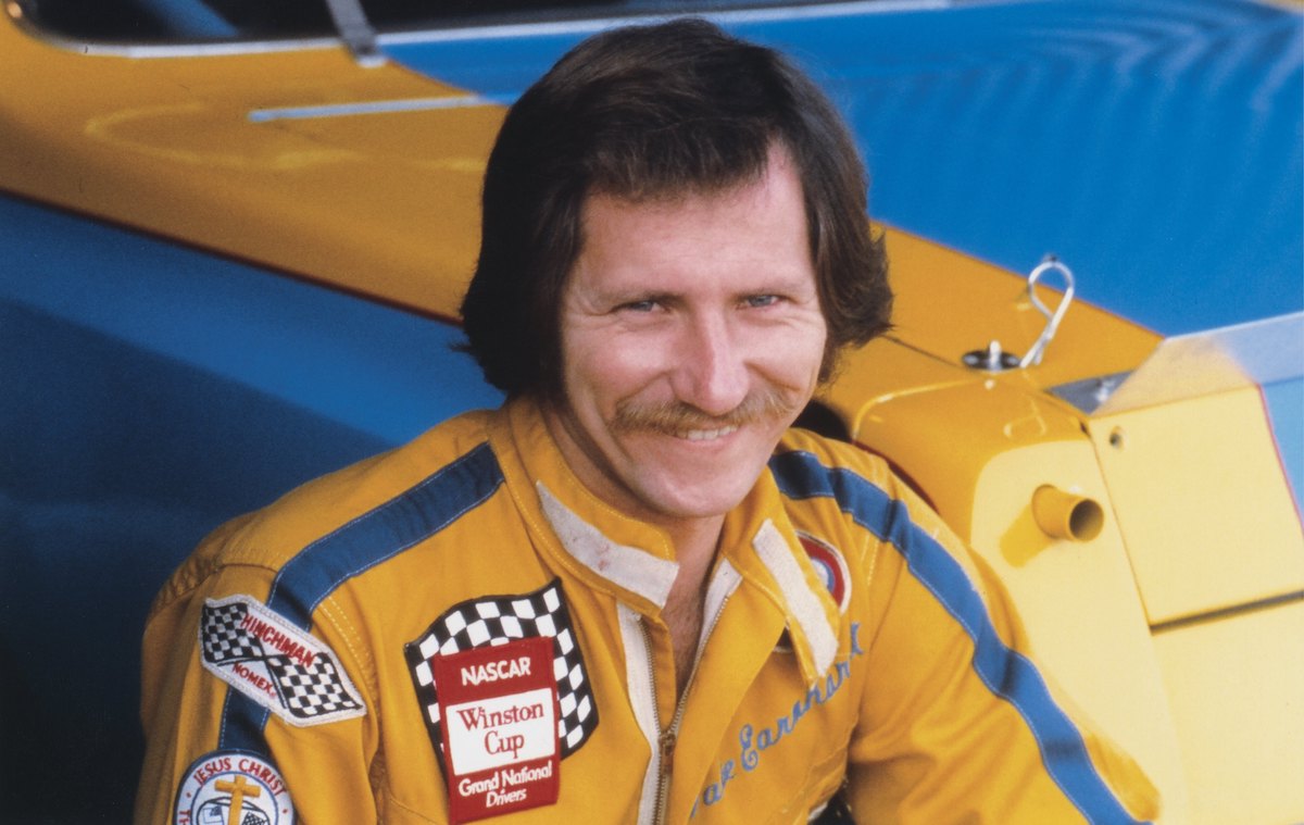 Dale Earnhardt St. in the driver's uniform that his son, Dale Earnhardt Jr., almost threw away decades later. 
