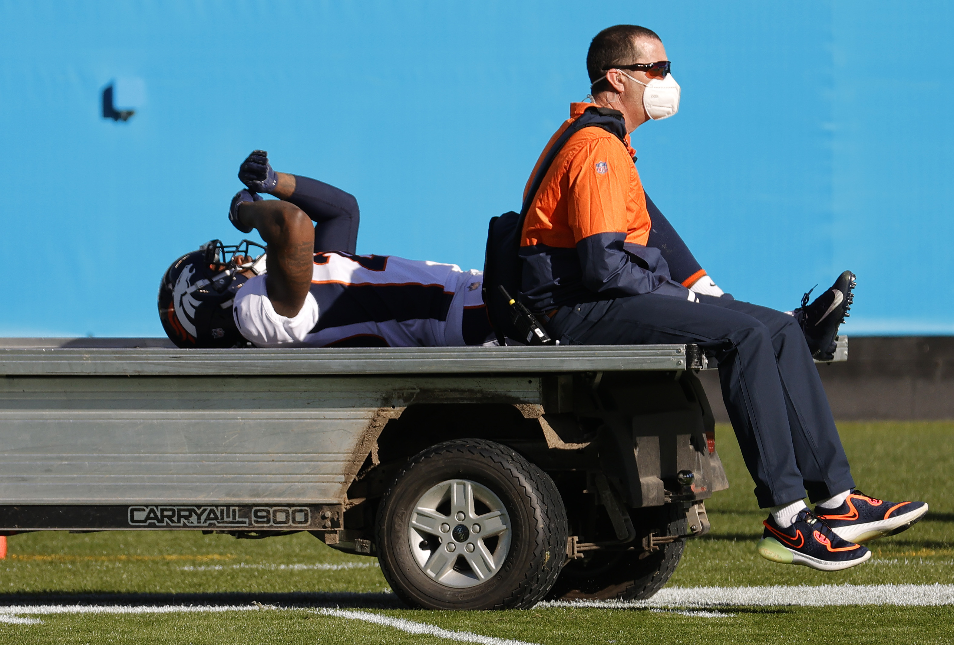 Duke Dawson Jr. of the Denver Broncos is carted off the field