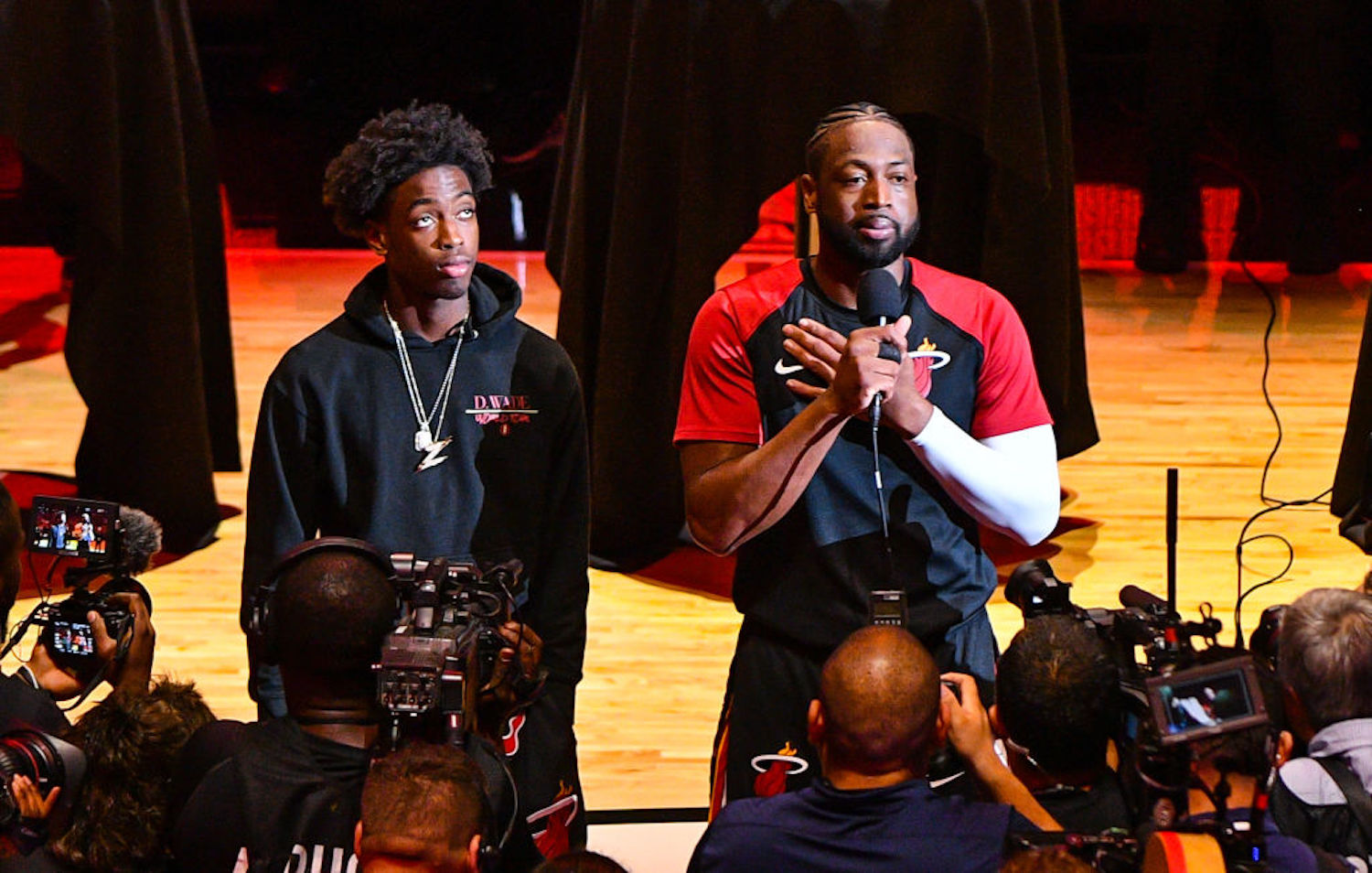 Dwyane Wade's teenage son Zaire is growing into a star basketball prospect, but he still gets humbled by his old man on the court.