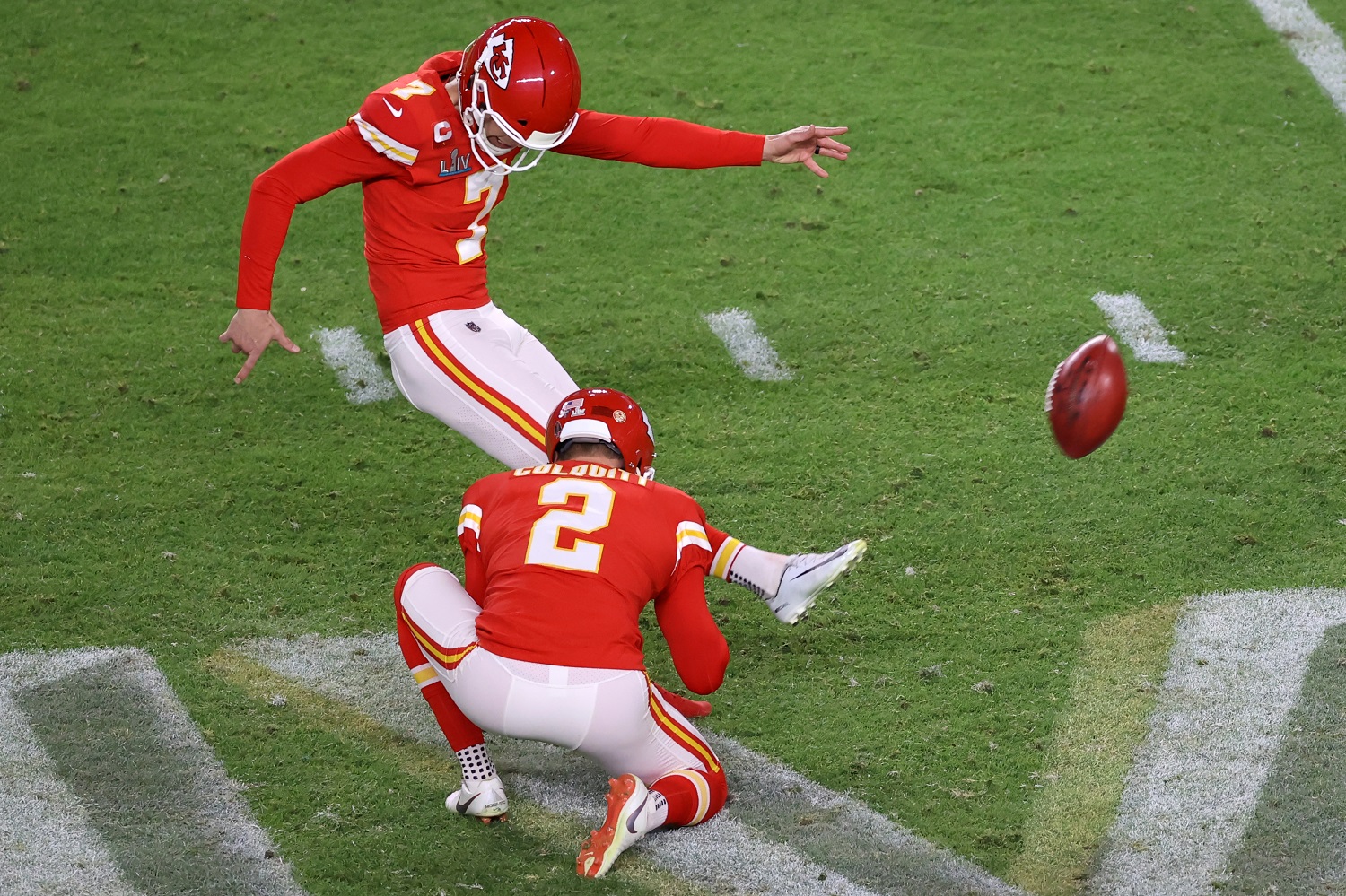 During the game, a soccer player kicked the ball