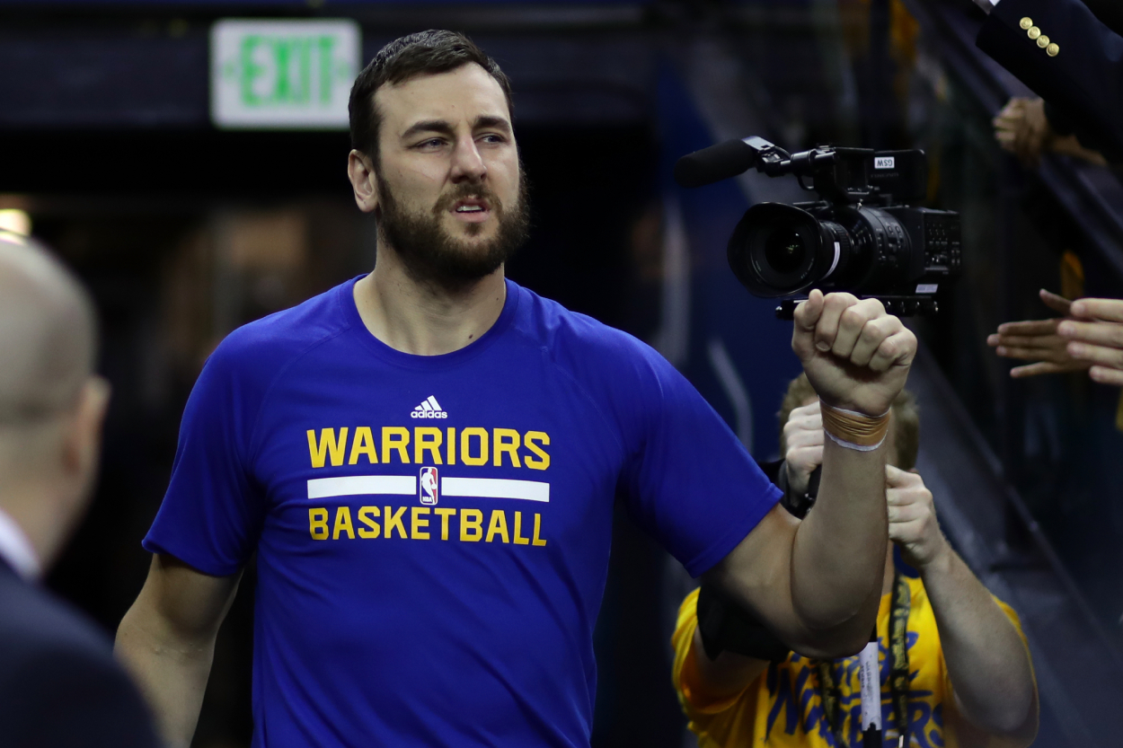 Andrew Bogut walks towards the court before a basketball game