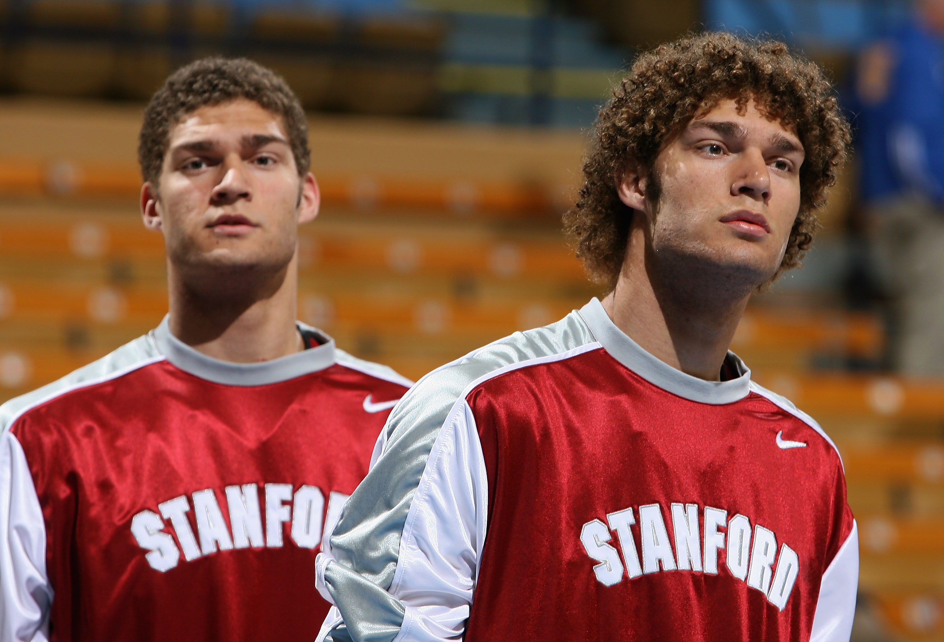 Brook and Robin Lopez look on before a basketbll game
