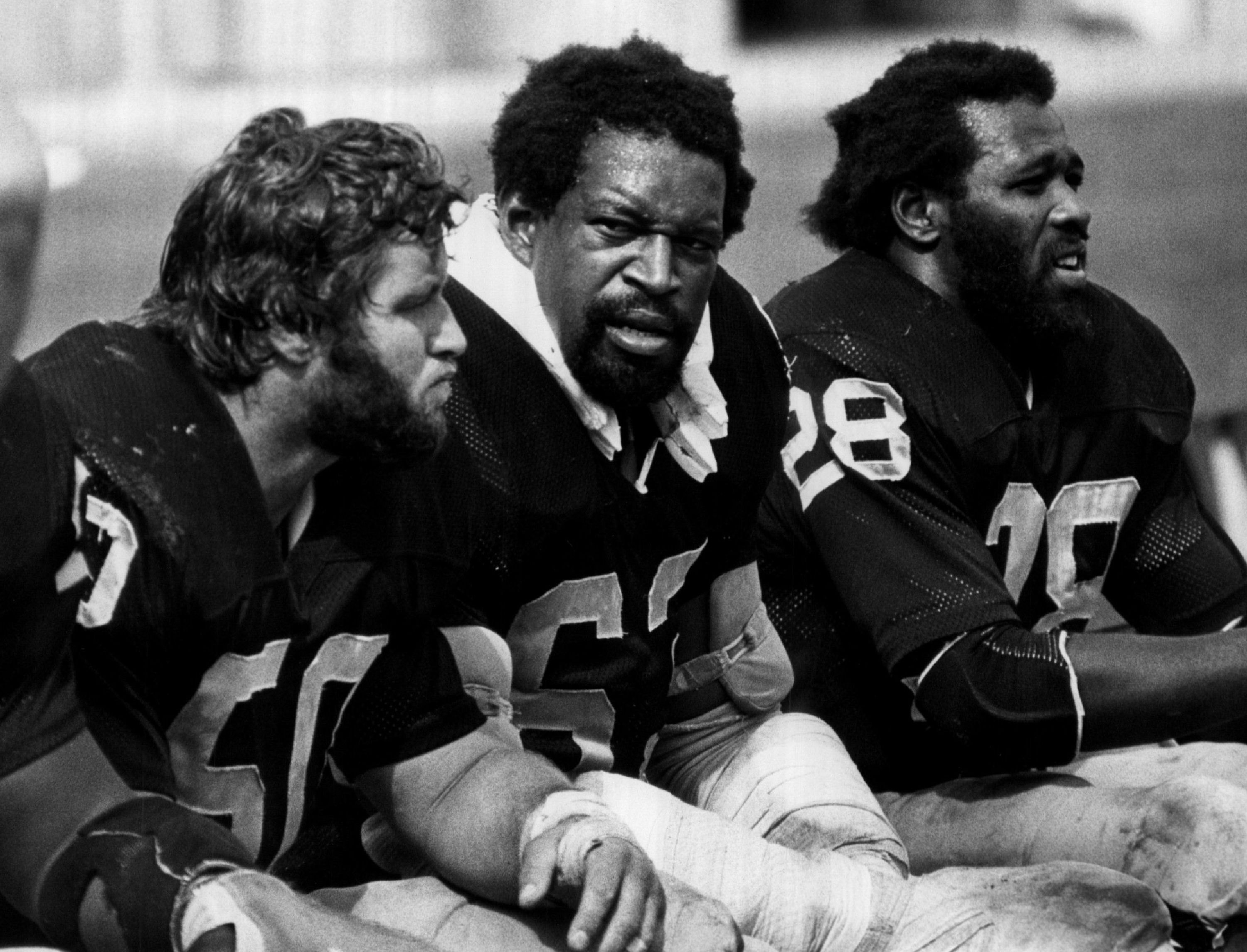 Clarence Davis, Gene Upshaw, and Dave Dalby of the Oakland Raiders in 1977