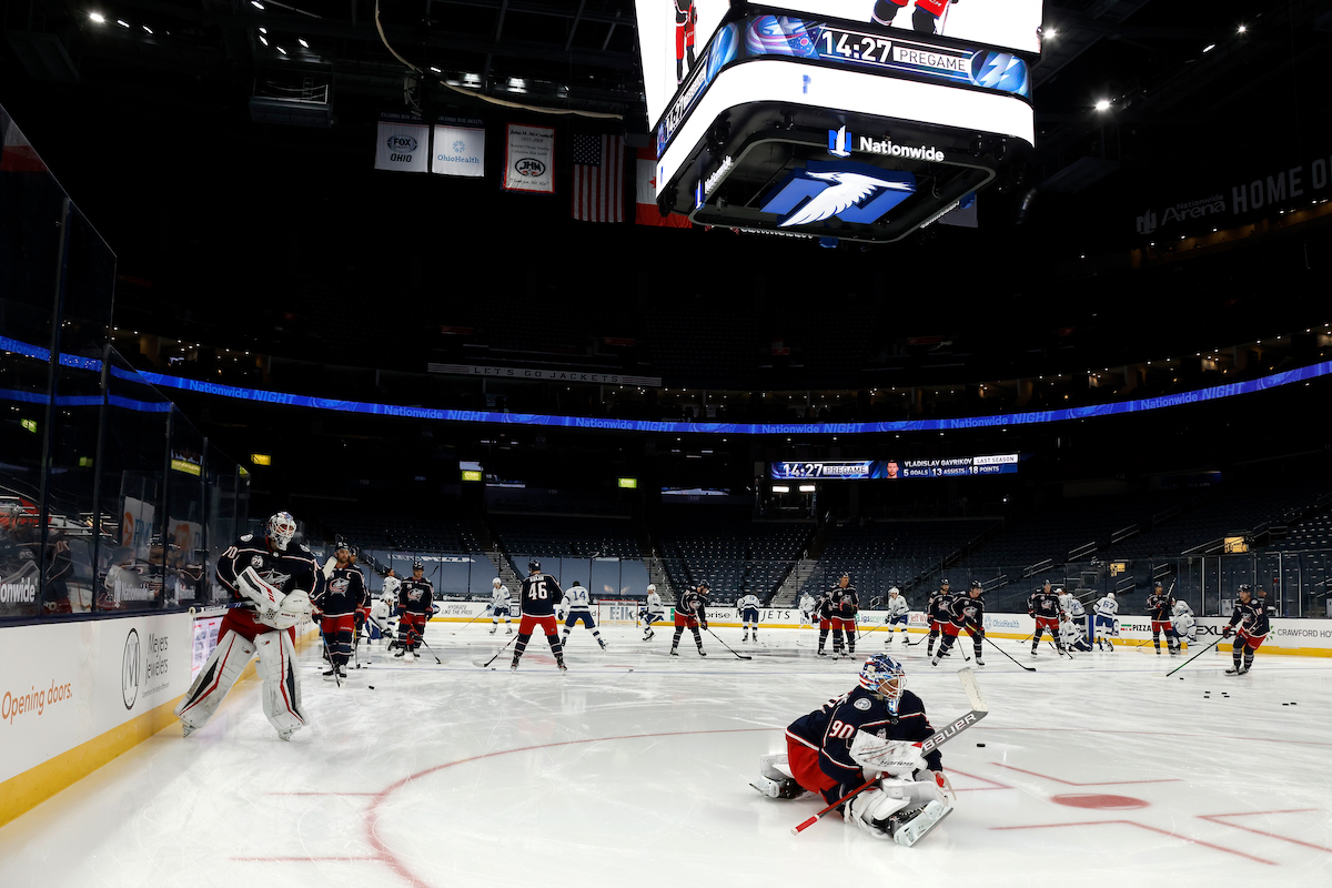 Elvis Merzlikins of the Columbus Blue Jackets stretches prior to the start of a game