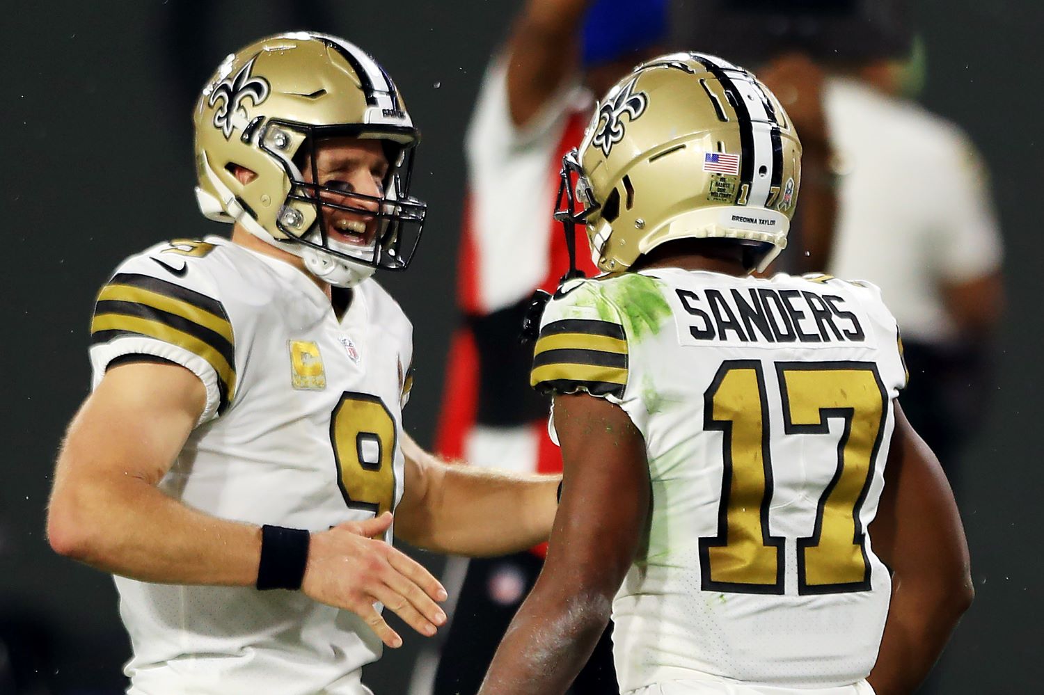 Drew Brees helped one of his New Orleans Saints teammates earn a $500,000 bonus in Sunday's 33-7 win against the Carolina Panthers.