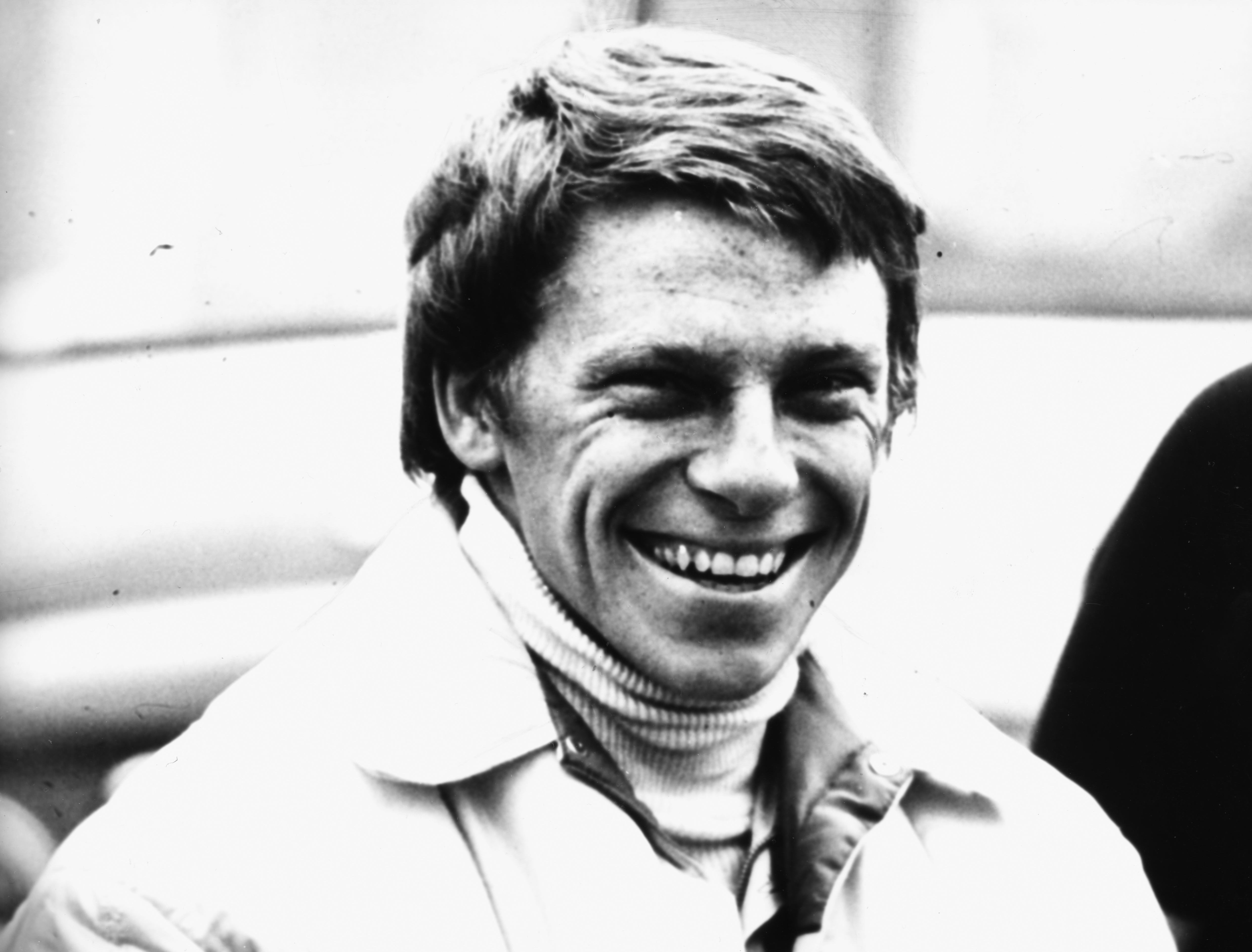 Driver Roger Williamson laughing, prior to his death at 25 years old