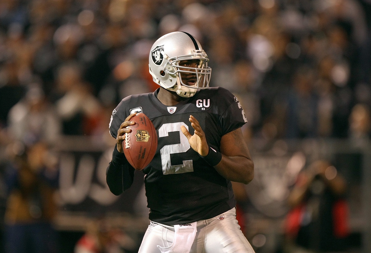 JaMarcus Russell looks for a received while he plays for the Raiders | Jed Jacobsohn/Getty Images
