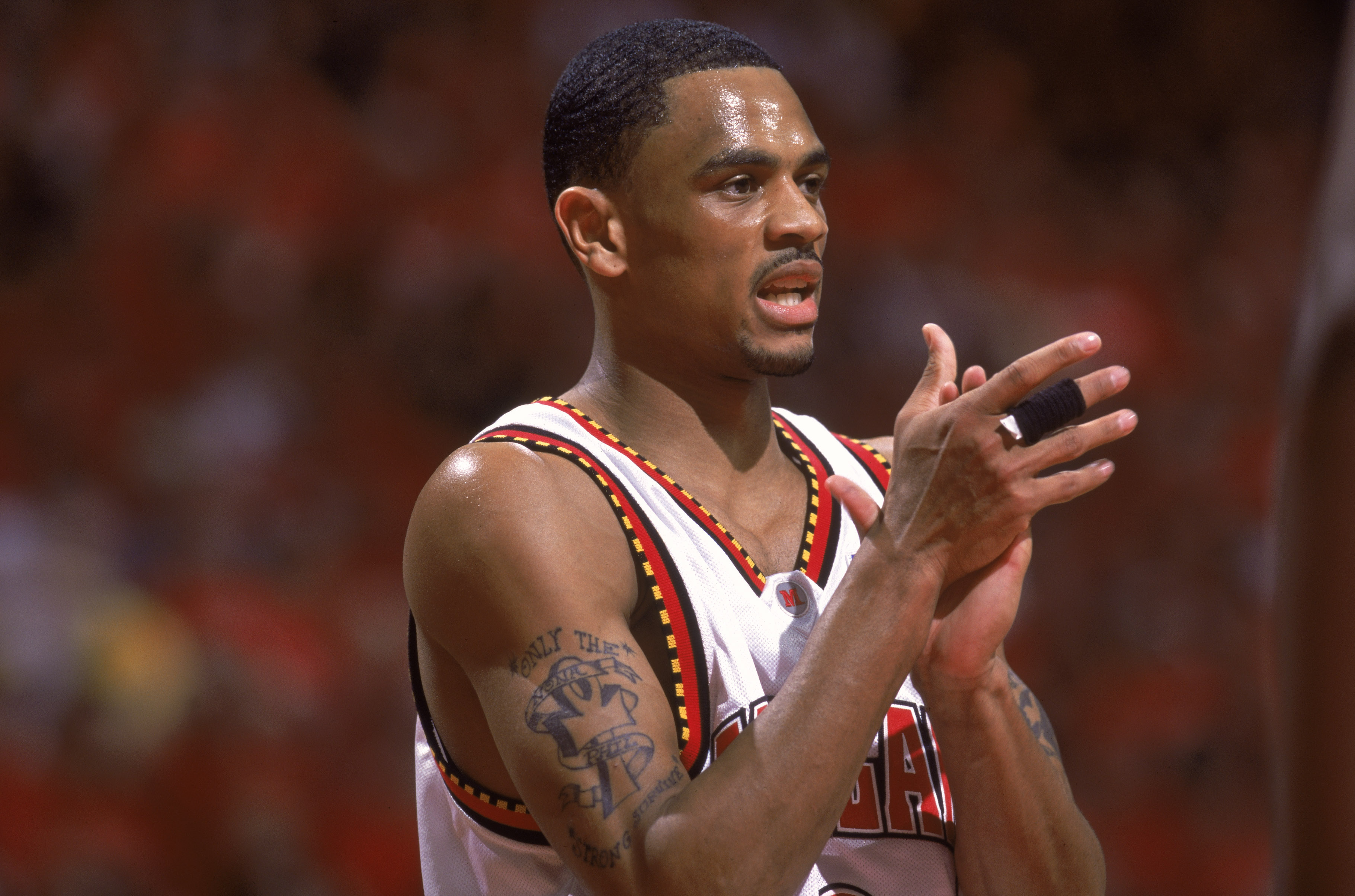 Juan Dixon of the University of Maryland Terrapins claps during a 2002 game