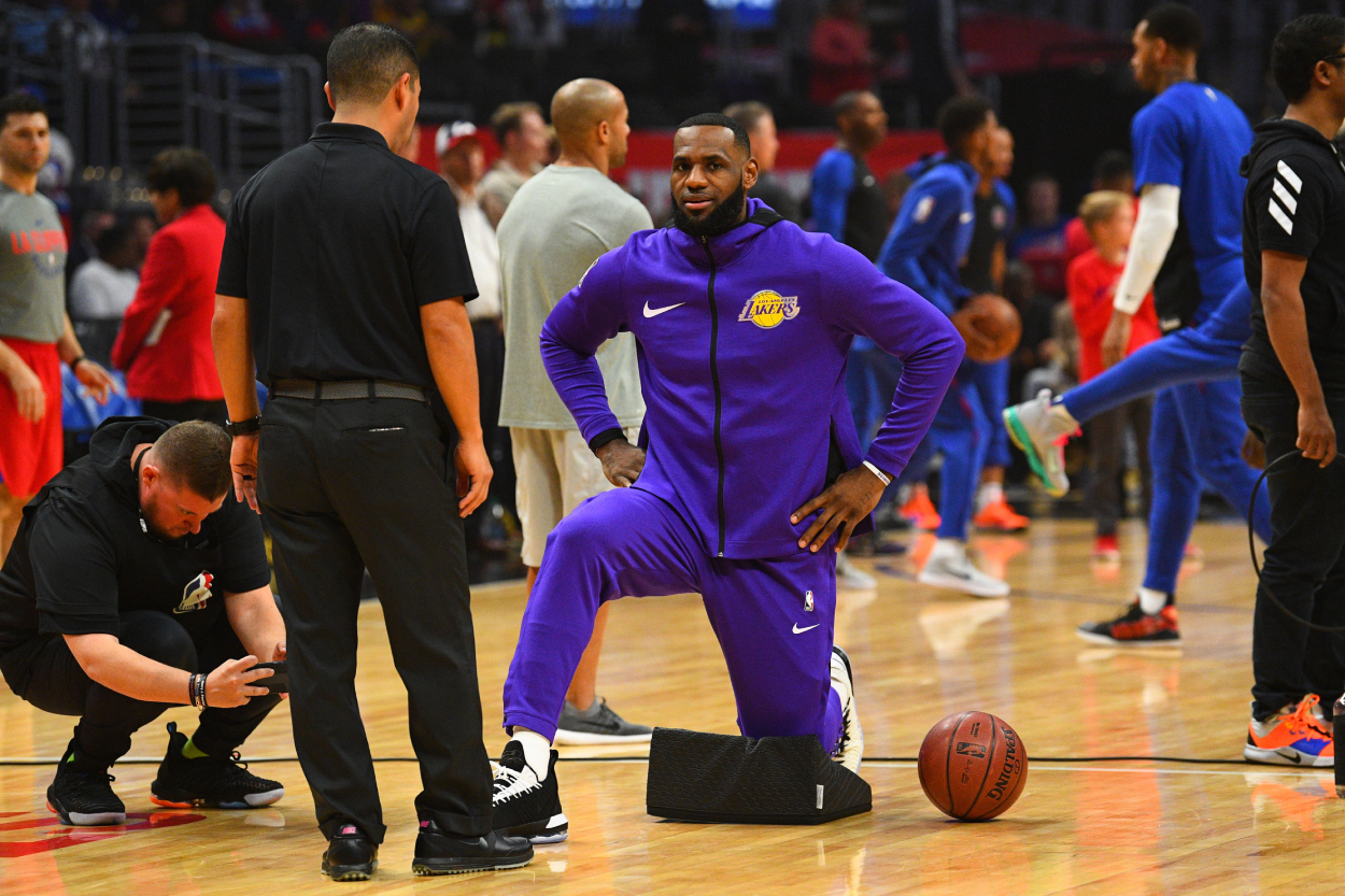 LeBron James stretching before a Lakers gmae
