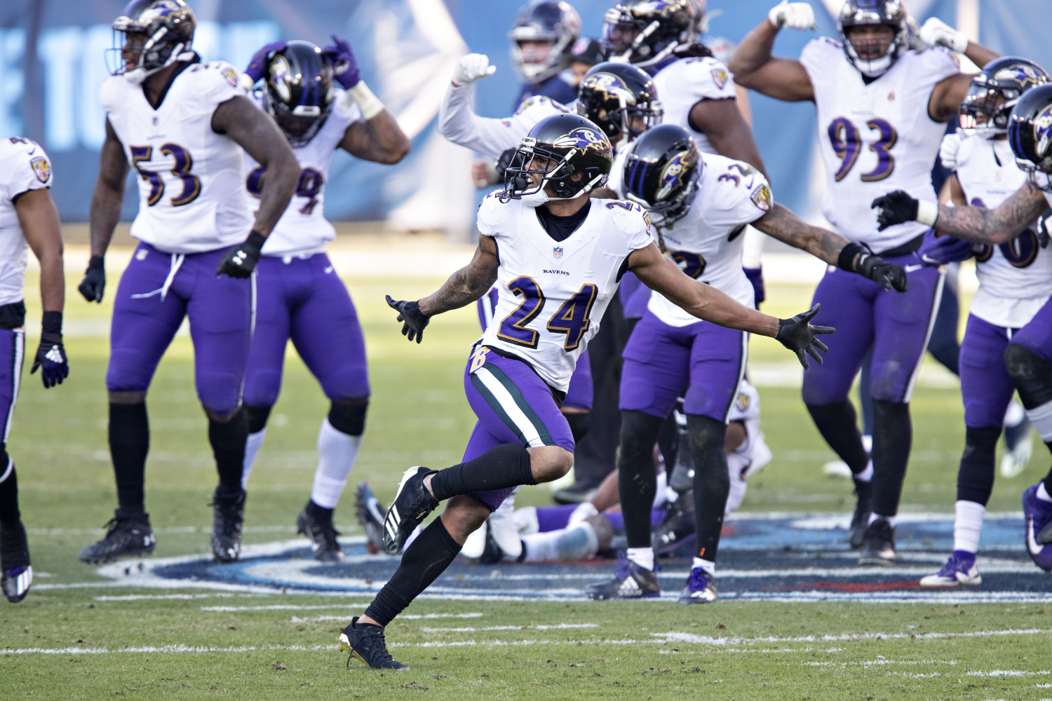 Marcus Peters celebrates an interception with his Ravens teammates