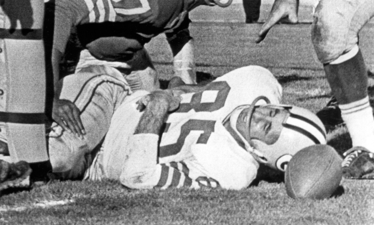 Max McGee lies unconscious after scoring a touchdown and colliding with the goal post on the field at Kezar Stadium, San Francisco, California, on December 10, 1961.