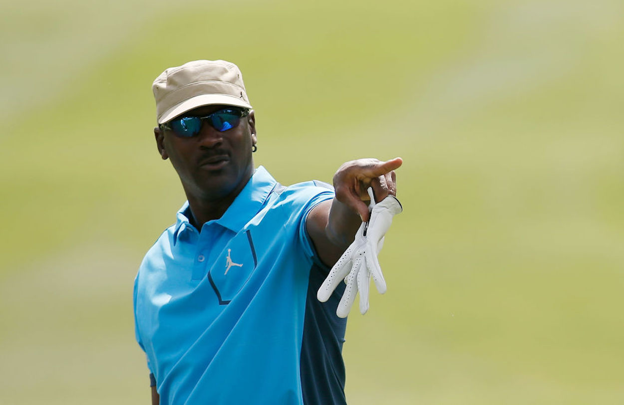 NBA legend Michael Jordan points on the golf course.