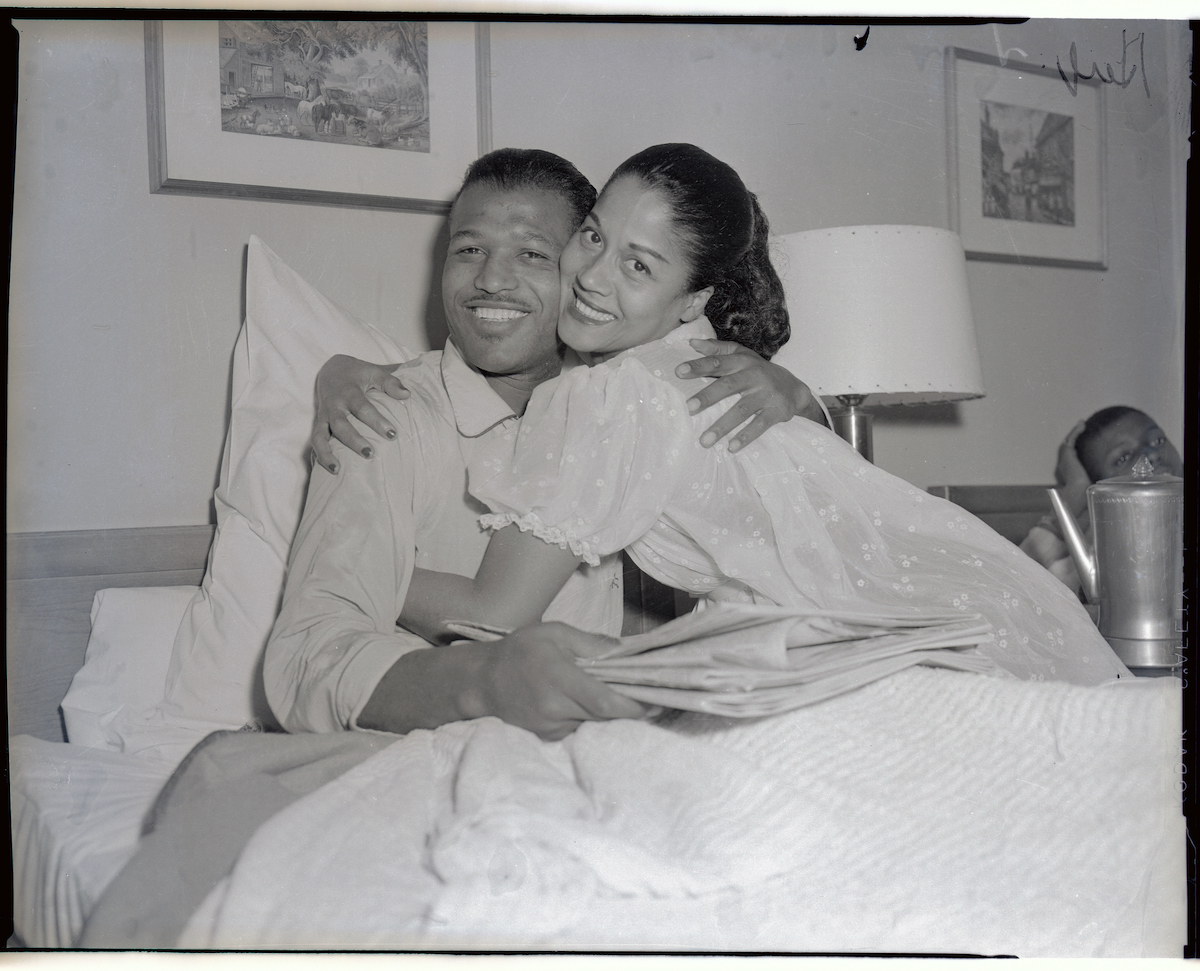 Edna Mae Robinson hugs her husband Sugar Ray Robinson in 1955