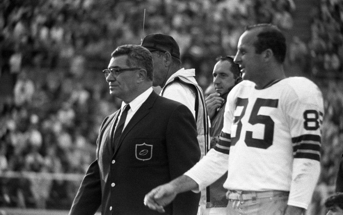 Head coach Vince Lombardi and wide receiver Max McGee of the Green Bay Packers walk the sidelines during the fourth quarter of Super Bowl II on January 14, 1968, against the Oakland Raiders at the Orange Bowl in Miami, Florida.