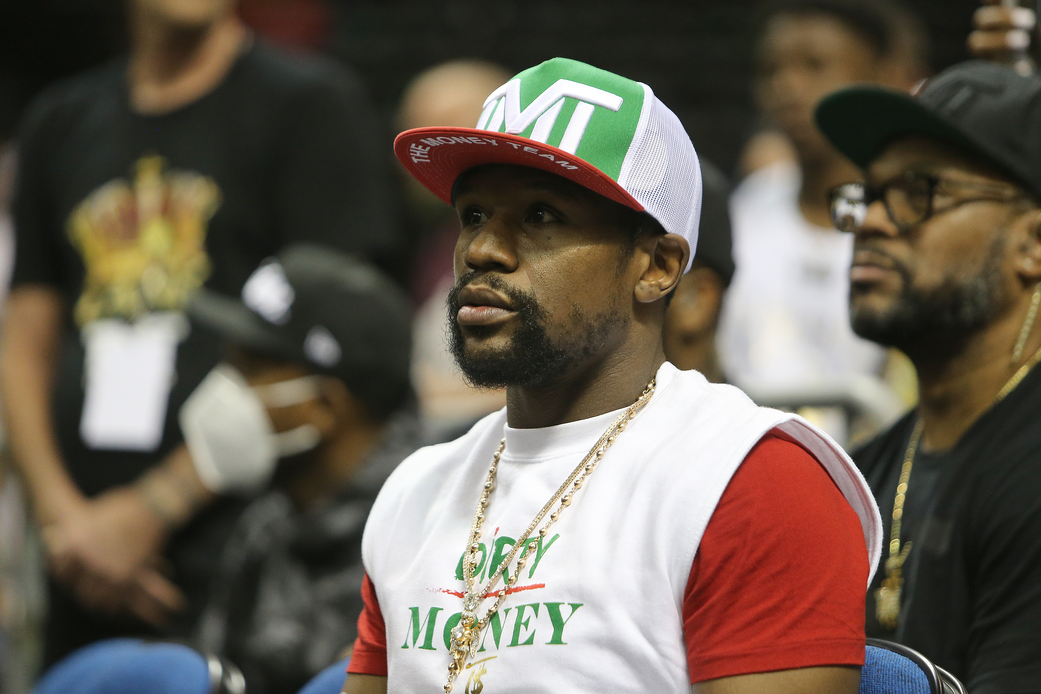 Champion boxer Floyd Mayweather Jr. sits ringside in 2020