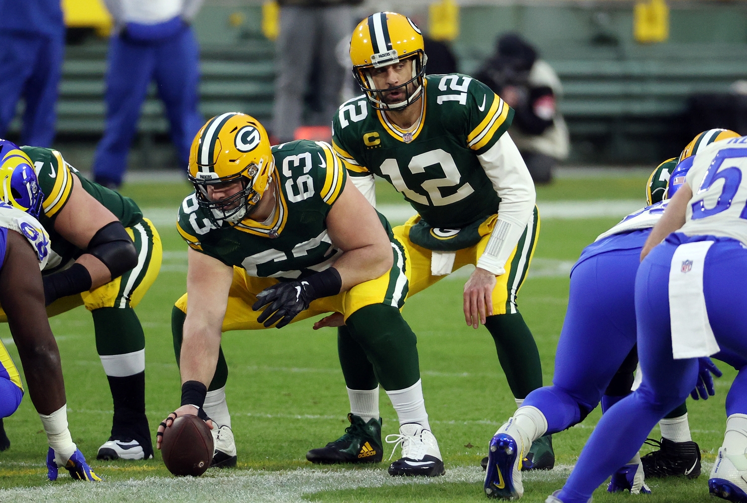 Aaron Rodgers prepares to take a snap from Packers center Corey Linsley during an NFC playoff game against the LA Rams.