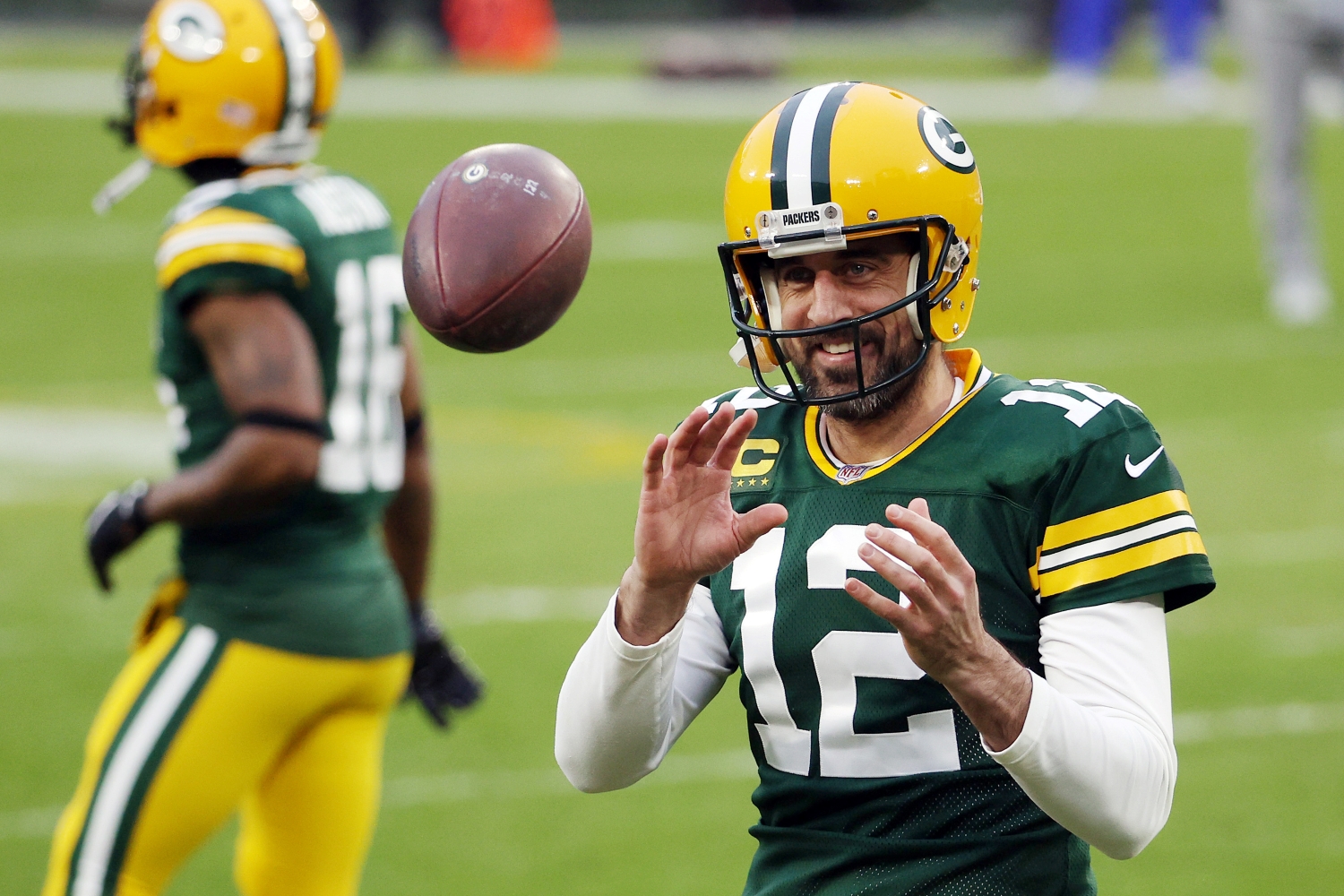 Aaron Rodgers of the Green Bay Packers warms up before the NFC Divisional Playoff game against the Los Angeles Rams.