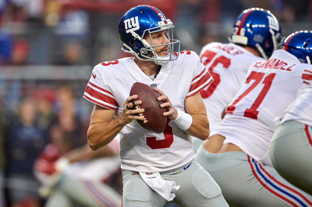 New York Giants quarterback Alex Tanney drops back to pass in a 2018 game.
