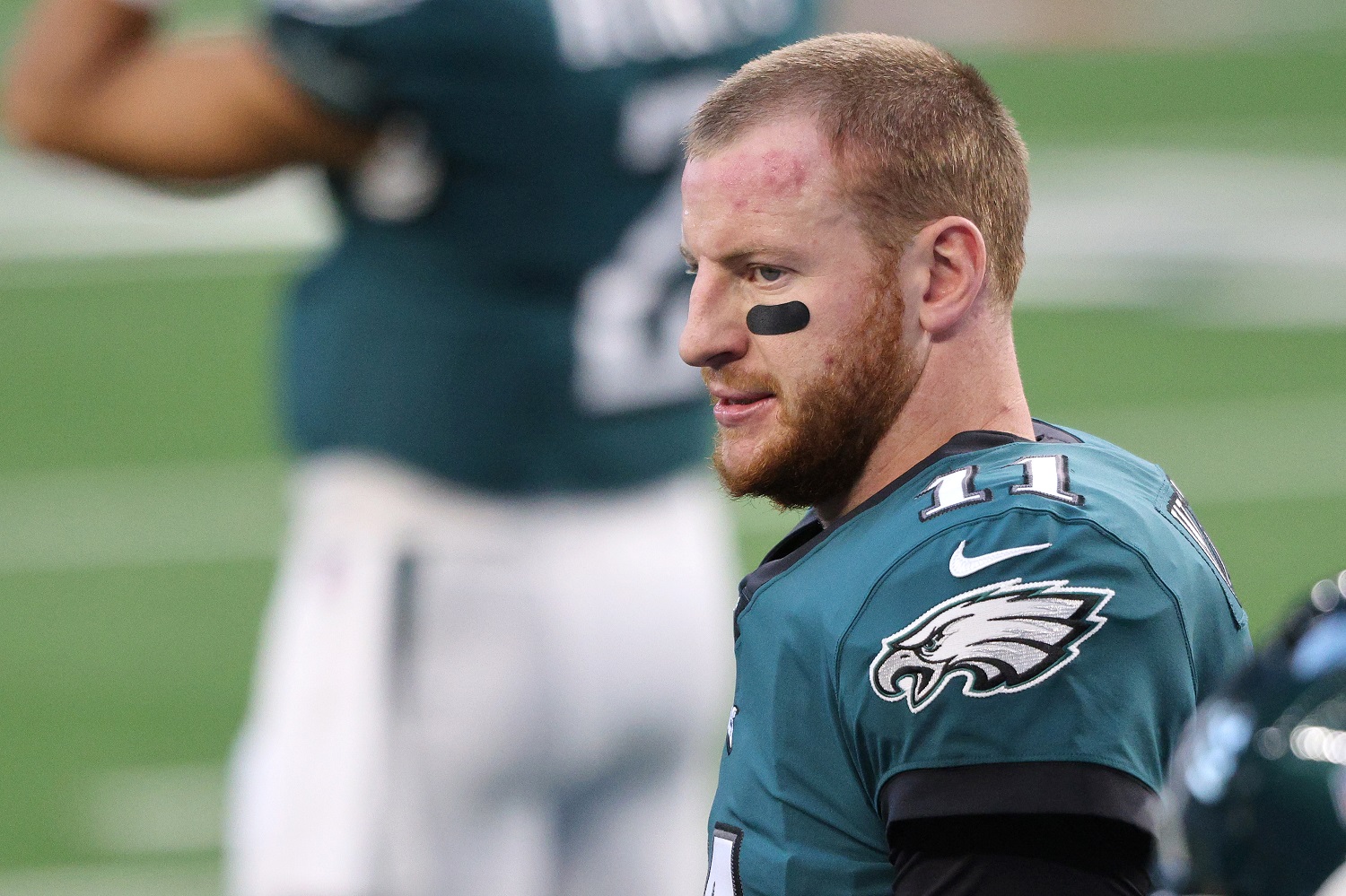 The Philadelphia Eagles benched Carson Wentz late in the 2020 season and now must take a salary-cap hit following his trade.
