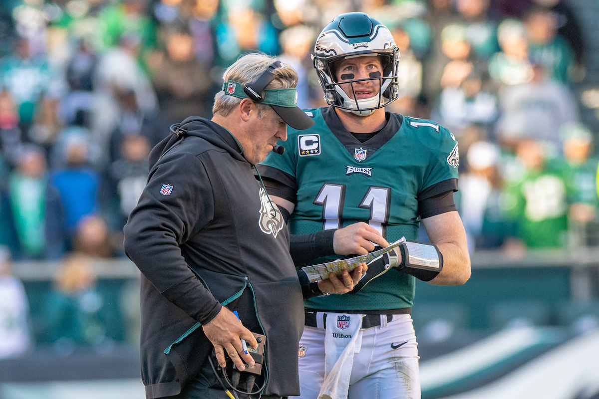 Philadelphia Eagles head coach Doug Pederson speaks to Carson Wentz