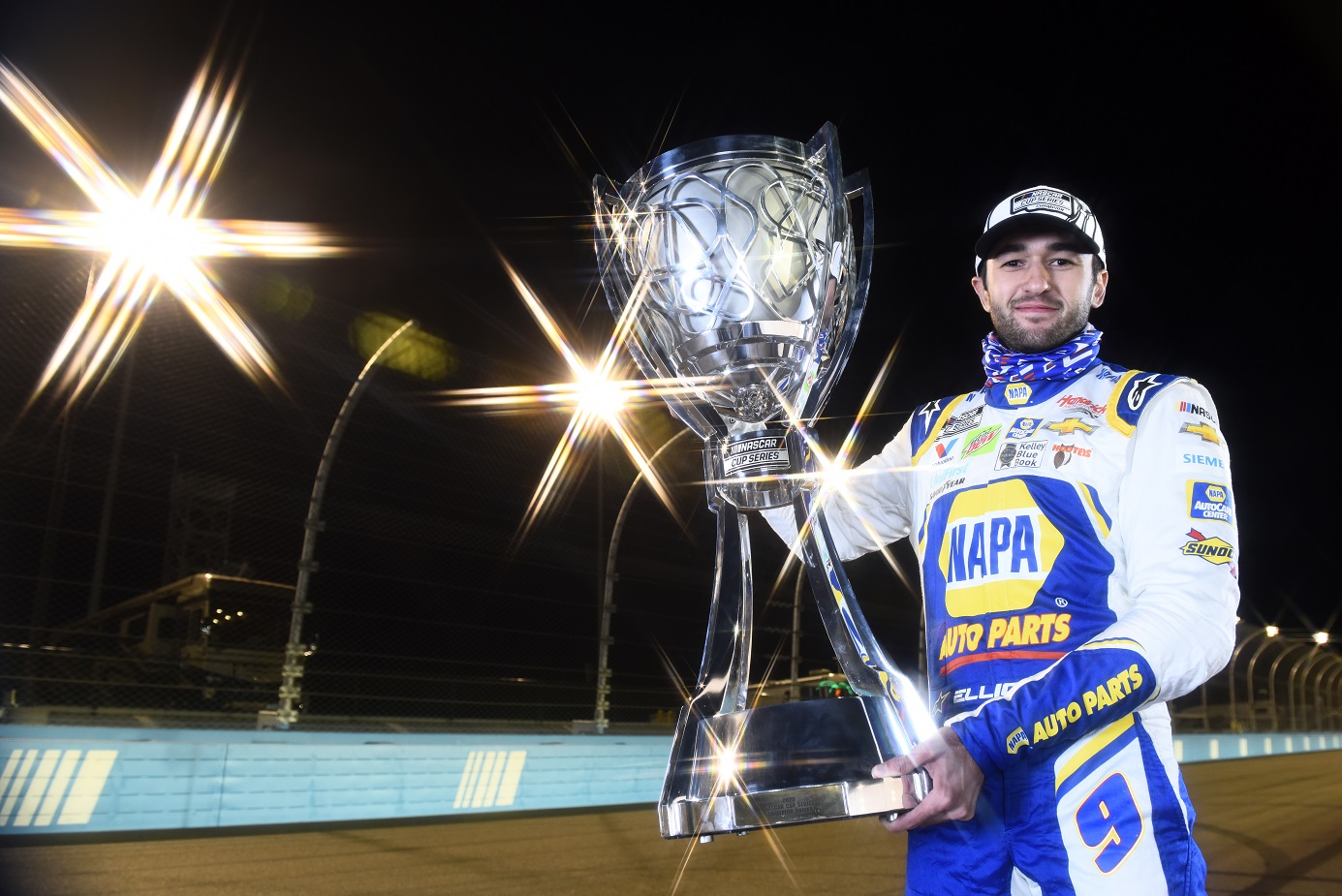 Chase Elliott holding NASCAR Cup trophy