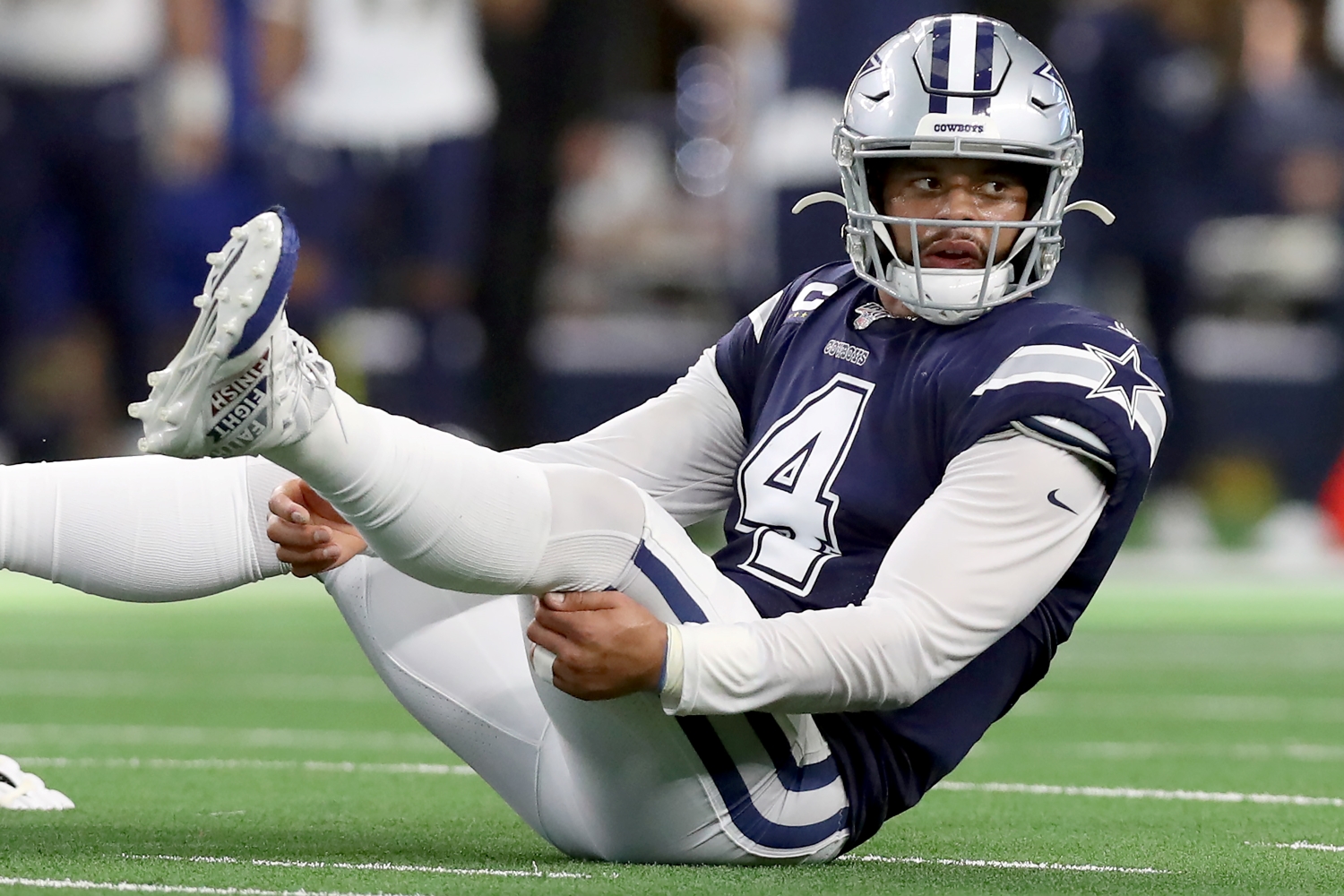 Dak Prescott of the Dallas Cowboys reacts after being knocked to the turf against the Los Angeles Rams.