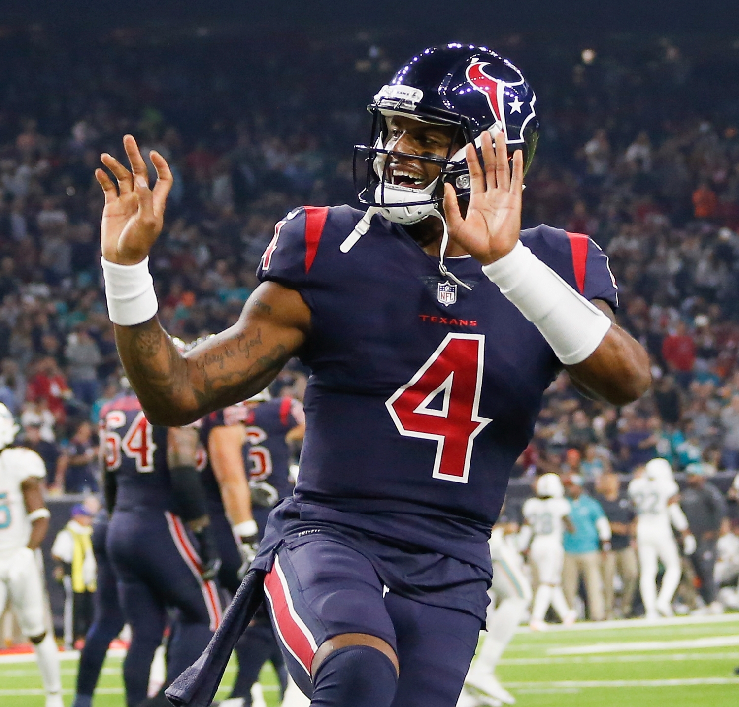 Deshaun Watson of the Houston Texans points to the crowd after Lamar Miller scored a touchdown against the Miami Dolphins at NRG Stadium.
