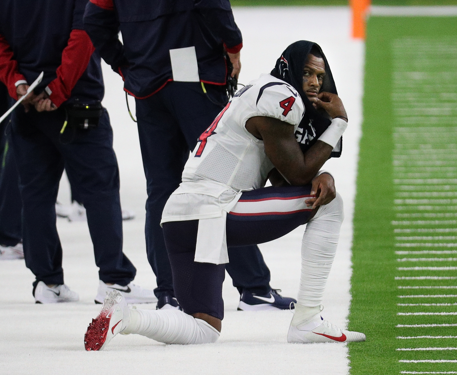Deshaun Watson of the Houston Texans sits on the sideline during the fourth quarter against the Baltimore Ravens at NRG Stadium on September 20, 2020 in Houston, Texas.