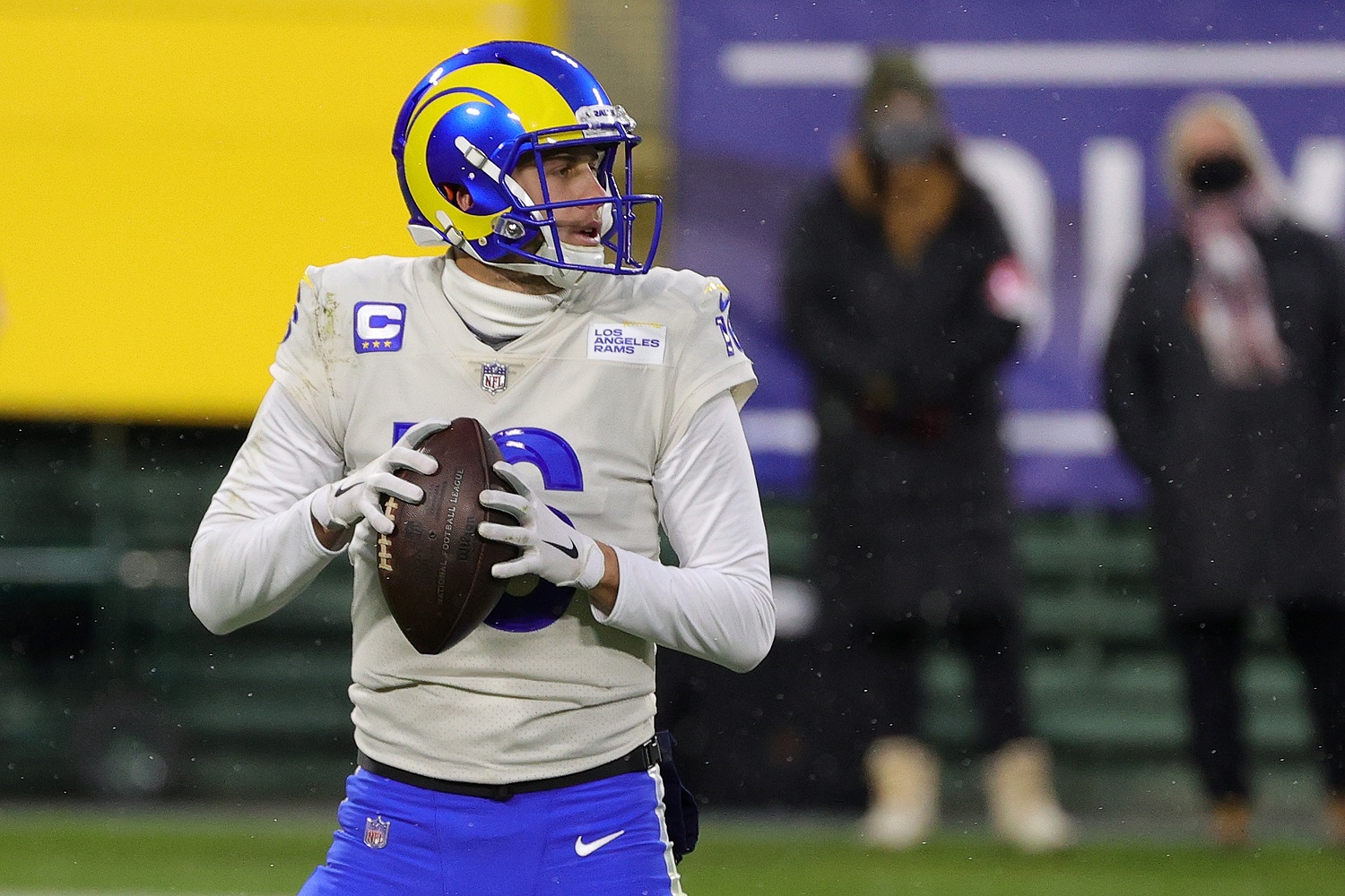 Jared Goff of the Los Angeles Rams drops back against the Green Bay Packers during the NFC divisional round game at Lambeau Field