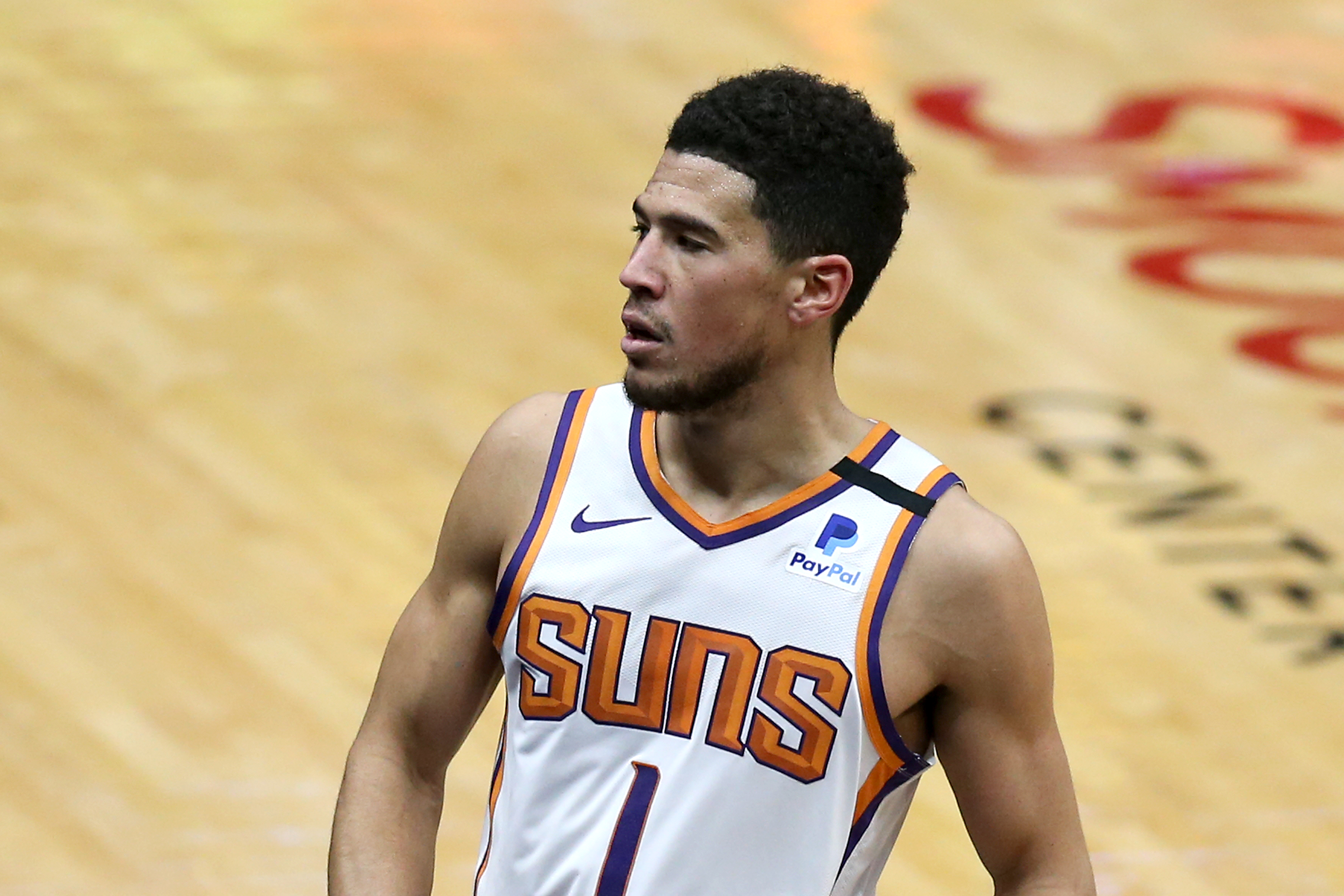 Devin Booker of the Phoenix Suns reacts after scoring