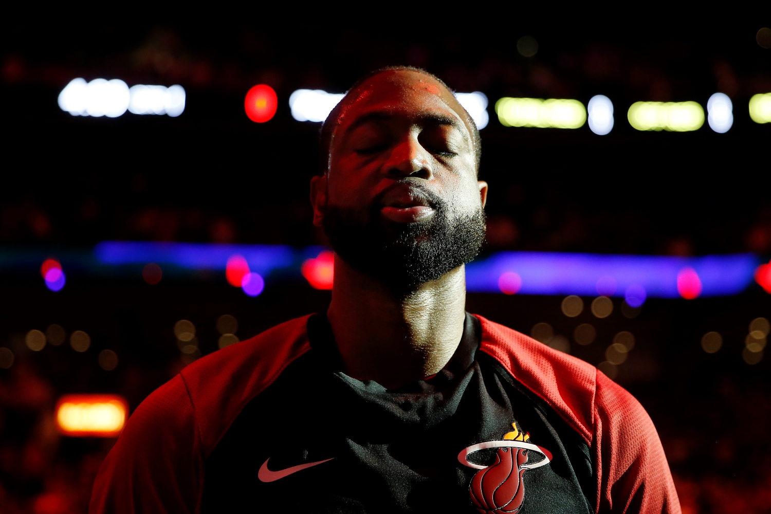 Dwyane Wade of the Miami Heat looks on during the playing of the national anthem prior to an NBA game.