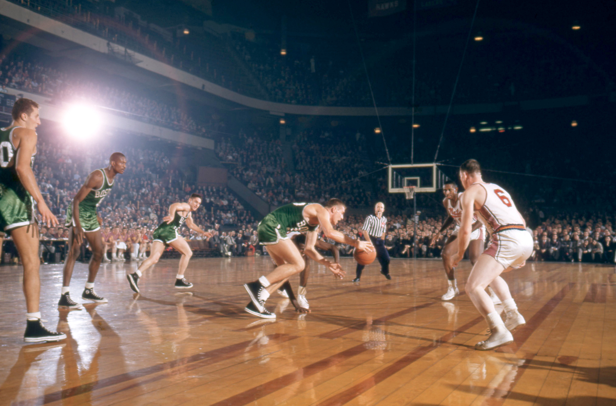 Earl Llyod defends a Celtics player with the ball