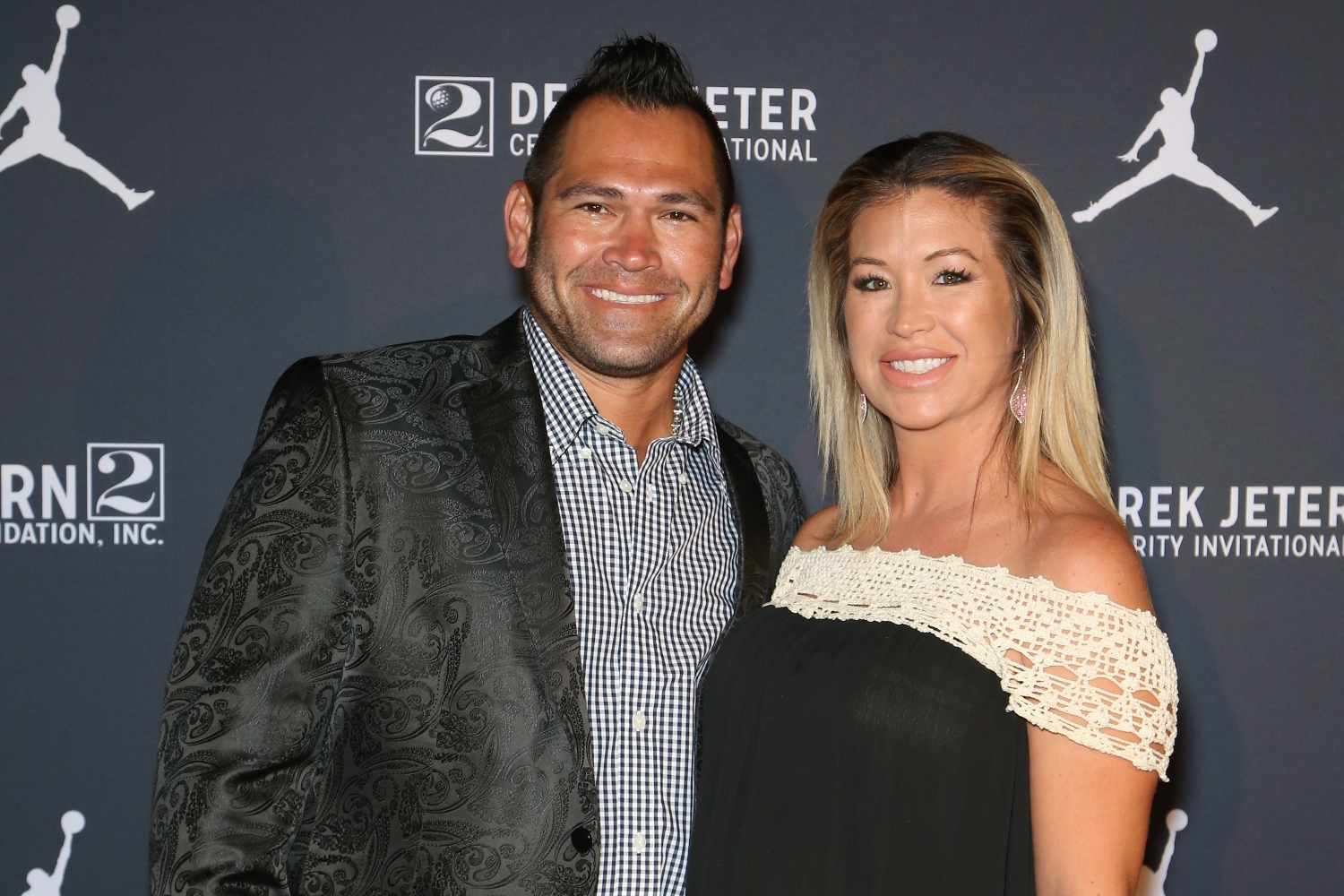Former MLB player Johnny Damon and his wife, Michelle Damon, arrive at the Liquid Pool Lounge for the kickoff of Derek Jeter's Celebrity Invitational at the Aria Resort & Casino.