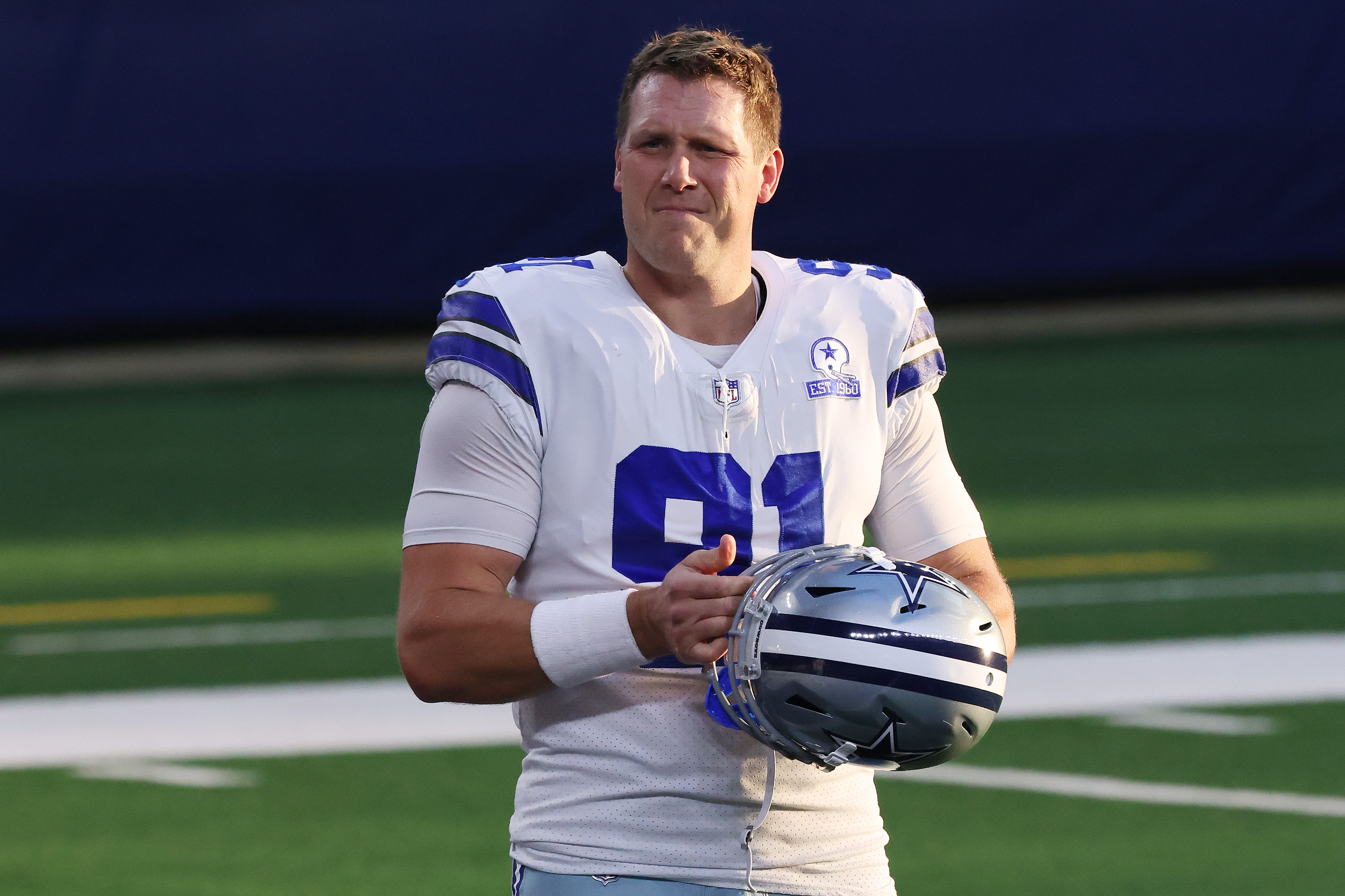 L.P. LaDouceur of the Dallas Cowboys looks on during warm-ups